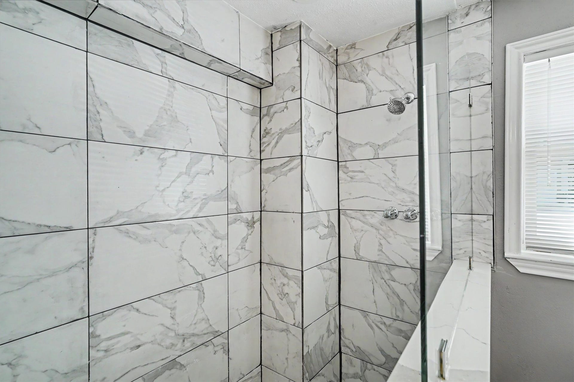 Custom tiled oversized walk in shower downstairs. Perfect after fishing days!