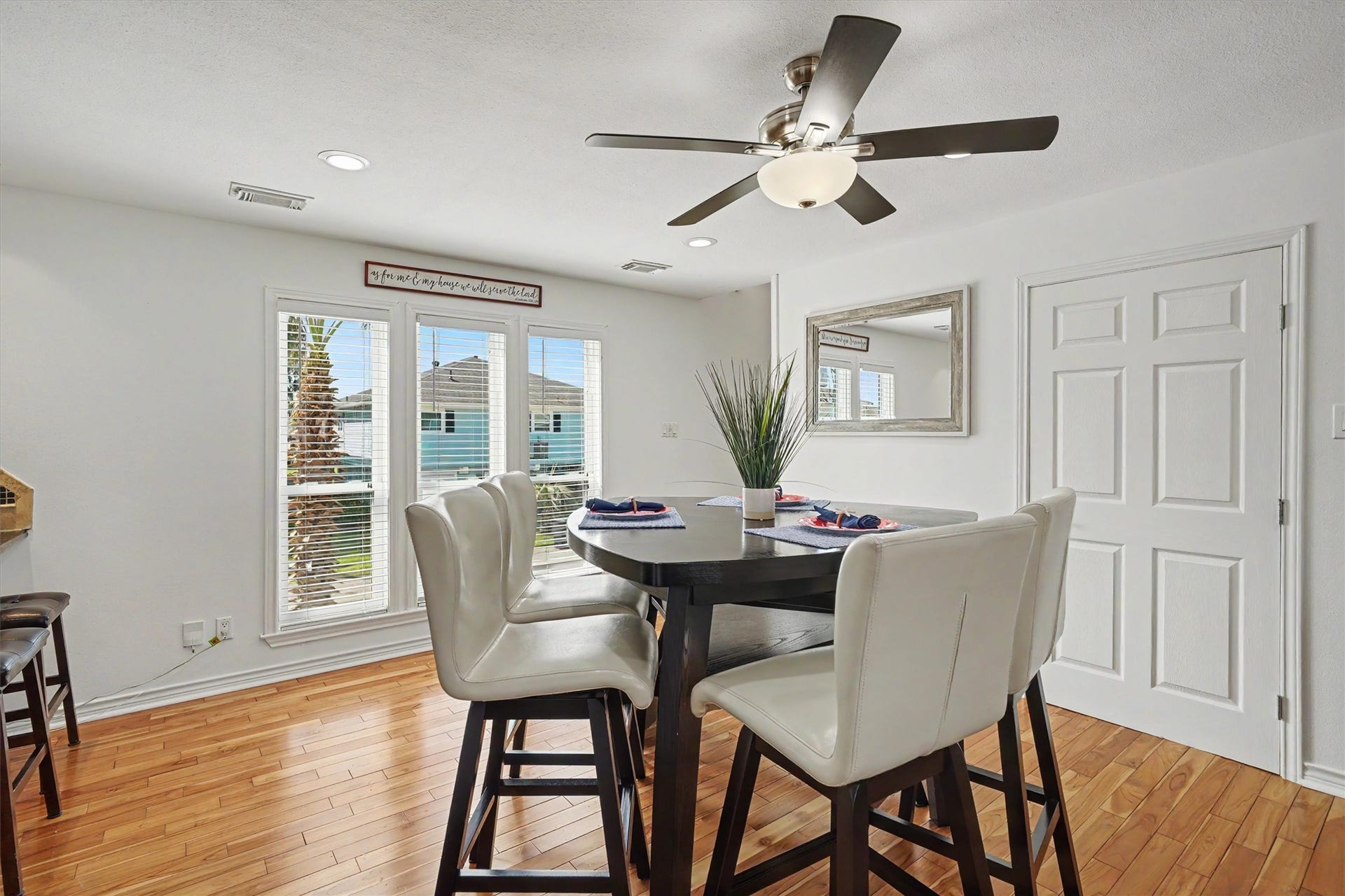 Dining room with windows allowing in plenty of natural lighting
