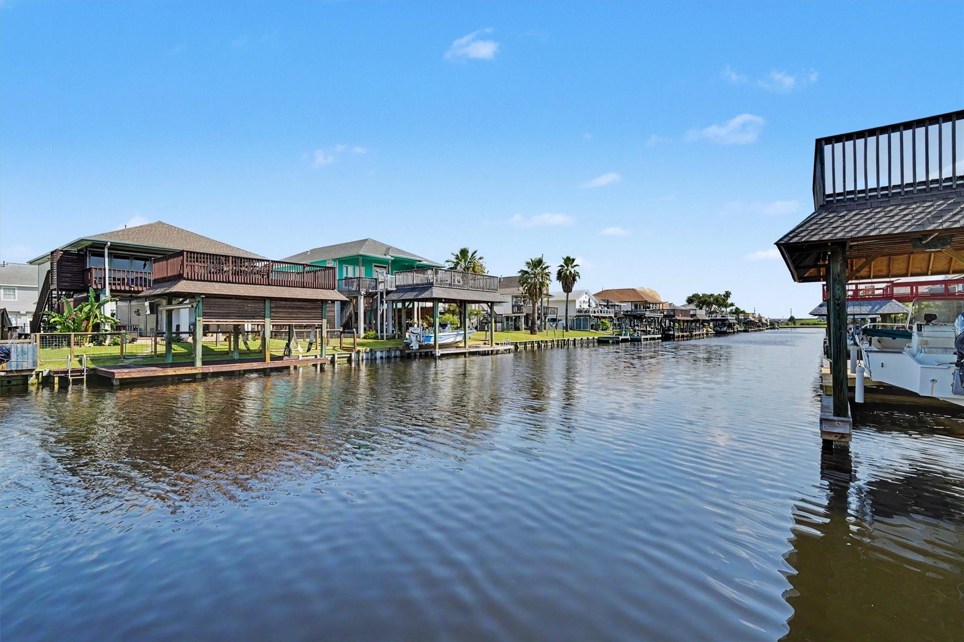 View of the canal! This is the magic where worry leaves your shoulders when you are sitting by the water. Watch the fish jump and the pelicans dive for their dinner
