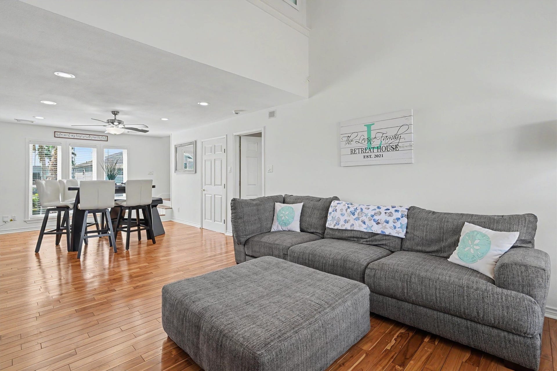 The living room is large and can hold a sectional sofa. The home has an open concept for entertaining