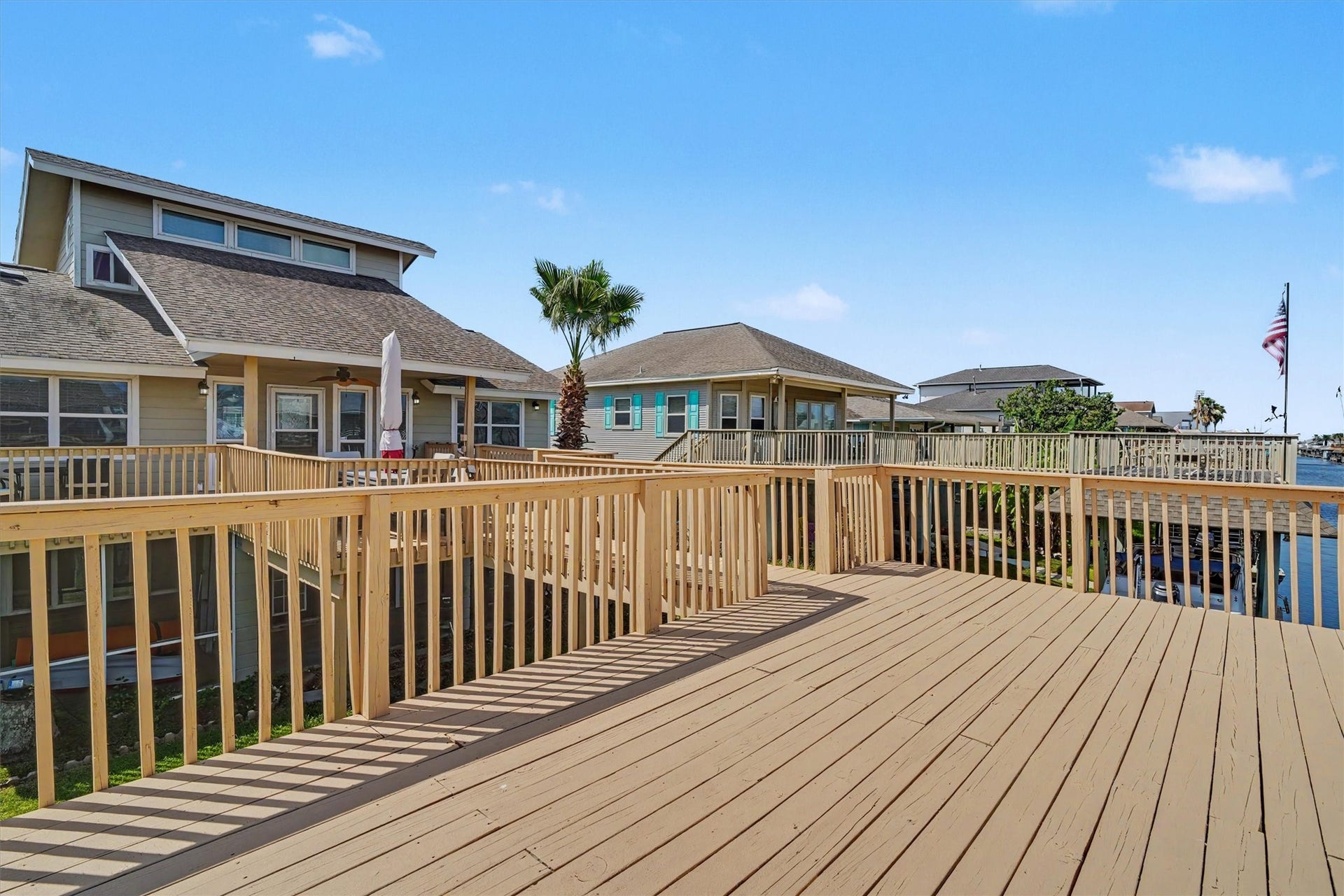 Upper party deck that's large enough for several areas of outdoor furniture