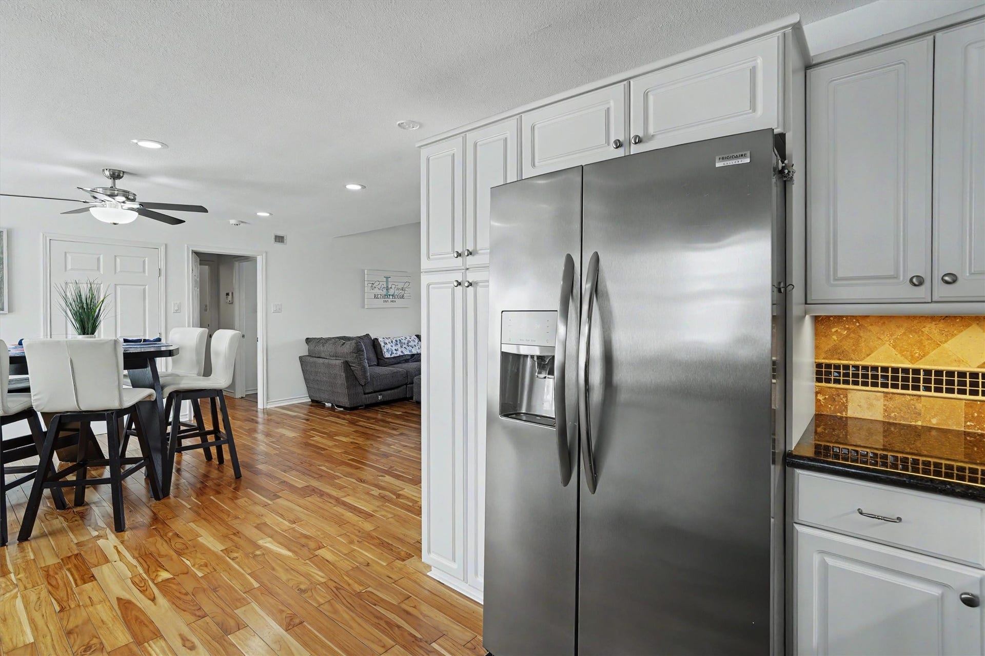 View from kitchen into the dining and living area. With the open concept entertaining in this home will be easy