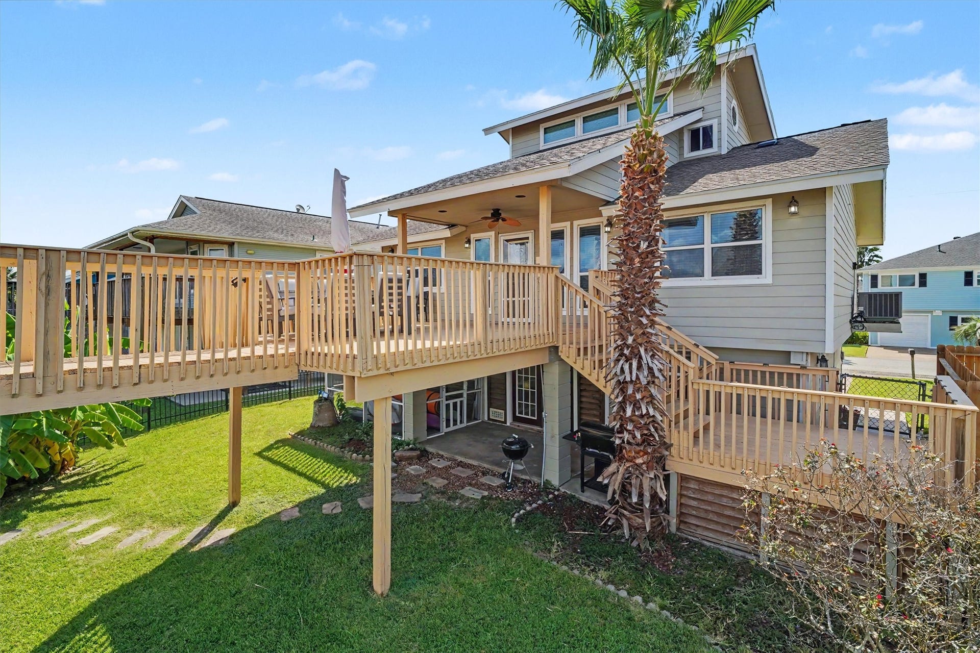 Waterside view of home. step outside to your private waterfront oasis featuring a catwalk leading to the spacious upper party deckthe perfect spot for entertaining, dining over the water, soaking up the sun, or enjoying breathtaking Bayou Vista sunsets.