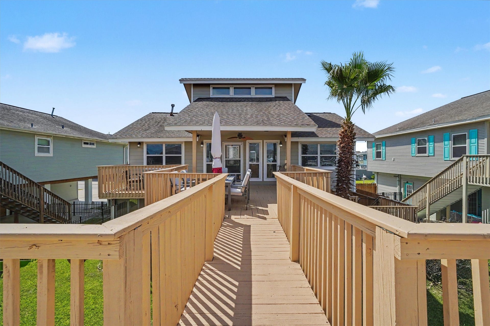 View of the water side of the home, from the upper party deck