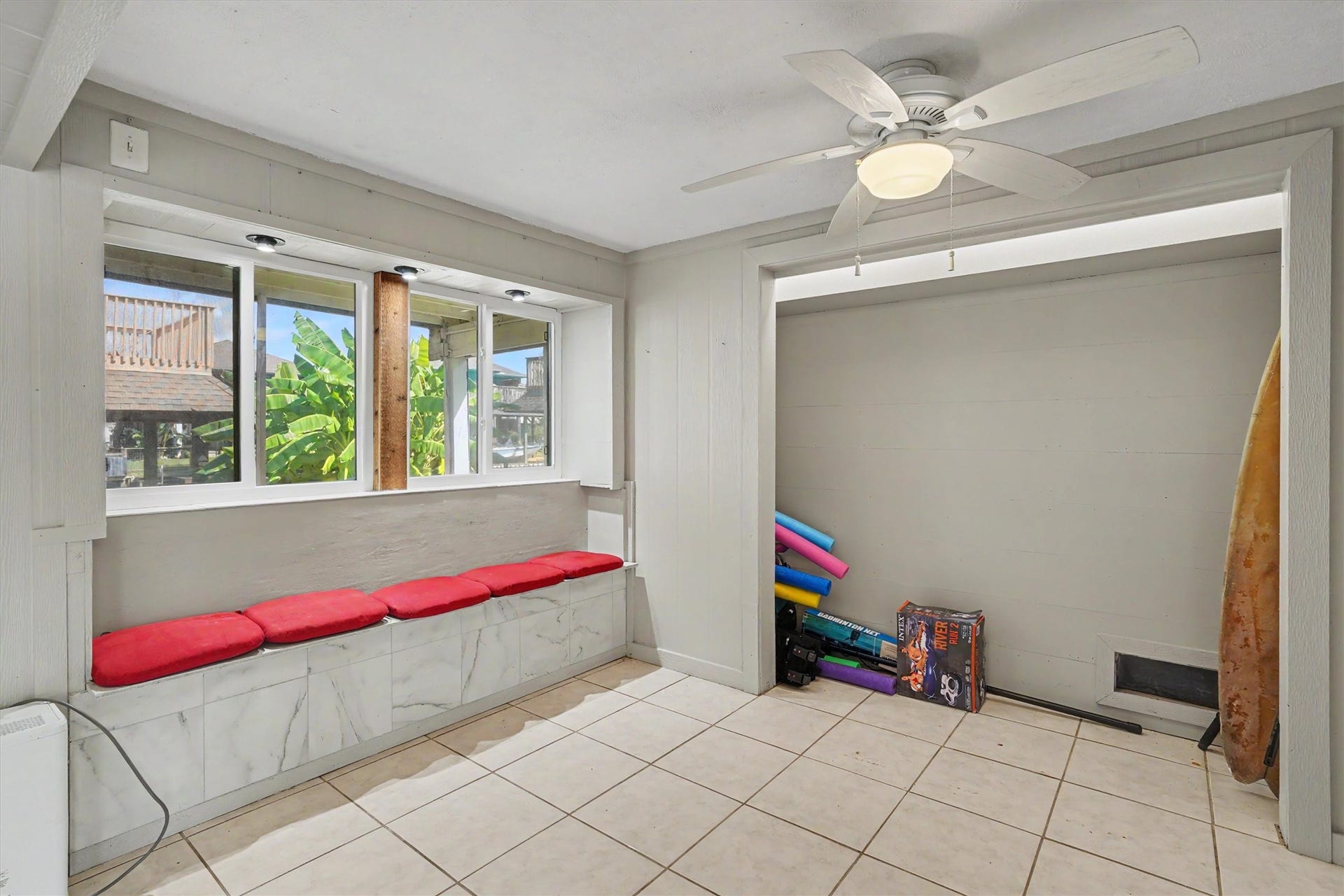 View of a section downstairs which could be a 4th bedroom, and a closet