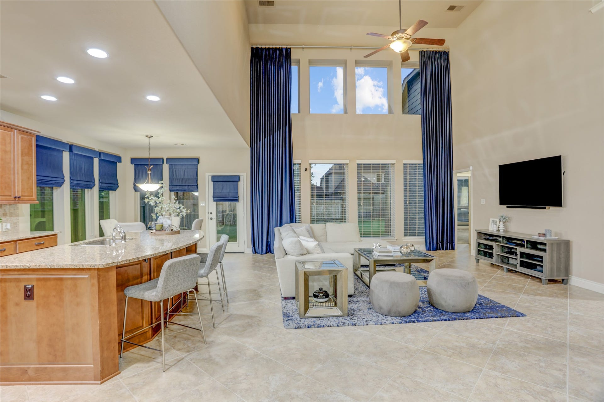 13308 Paxton Hill Court, Pearland, TX 77584 The heart of the home features an open concept design with a dramatic two-story family room, soaring ceilings, expansive windows that flood the space with natural light, and seamless flow into the gourmet kitchen and breakfast area. Perfect for everyday living and effortless entertaining.