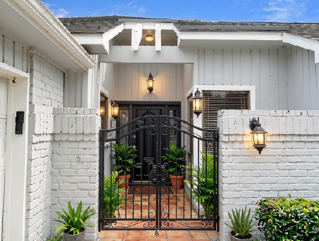 12107 Carriage Hill Drive, Houston, TX 77077 Virtually staged Courtyard style entrance.