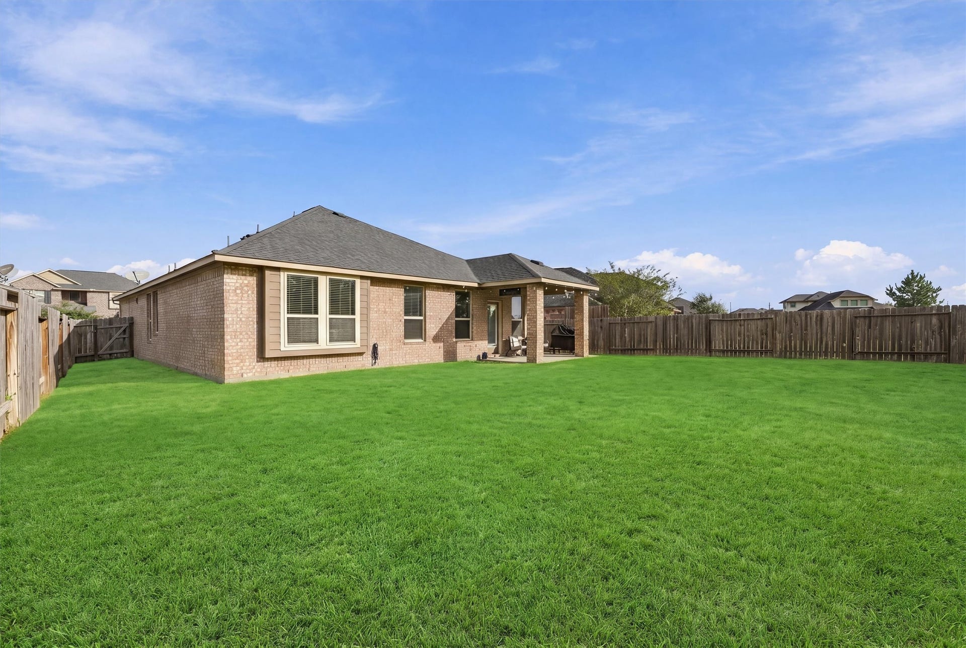 31549 Timber Grove Lane, Spring, TX 77386 Spacious backyard with plenty of room for kids and pets to play in.