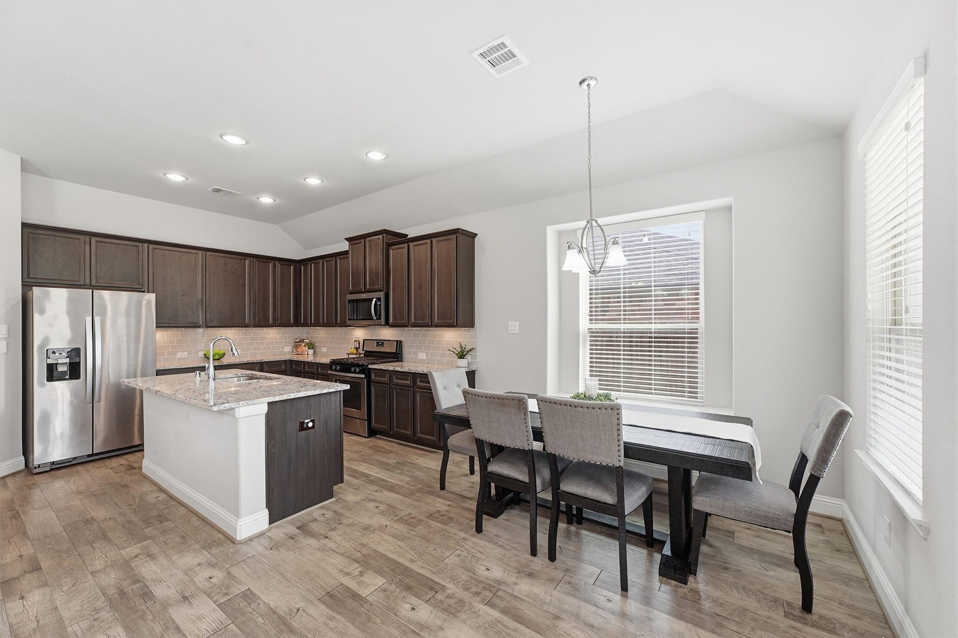 31549 Timber Grove Lane, Spring, TX 77386 Casual dining area with bay window seating and convenient access to the kitchen.