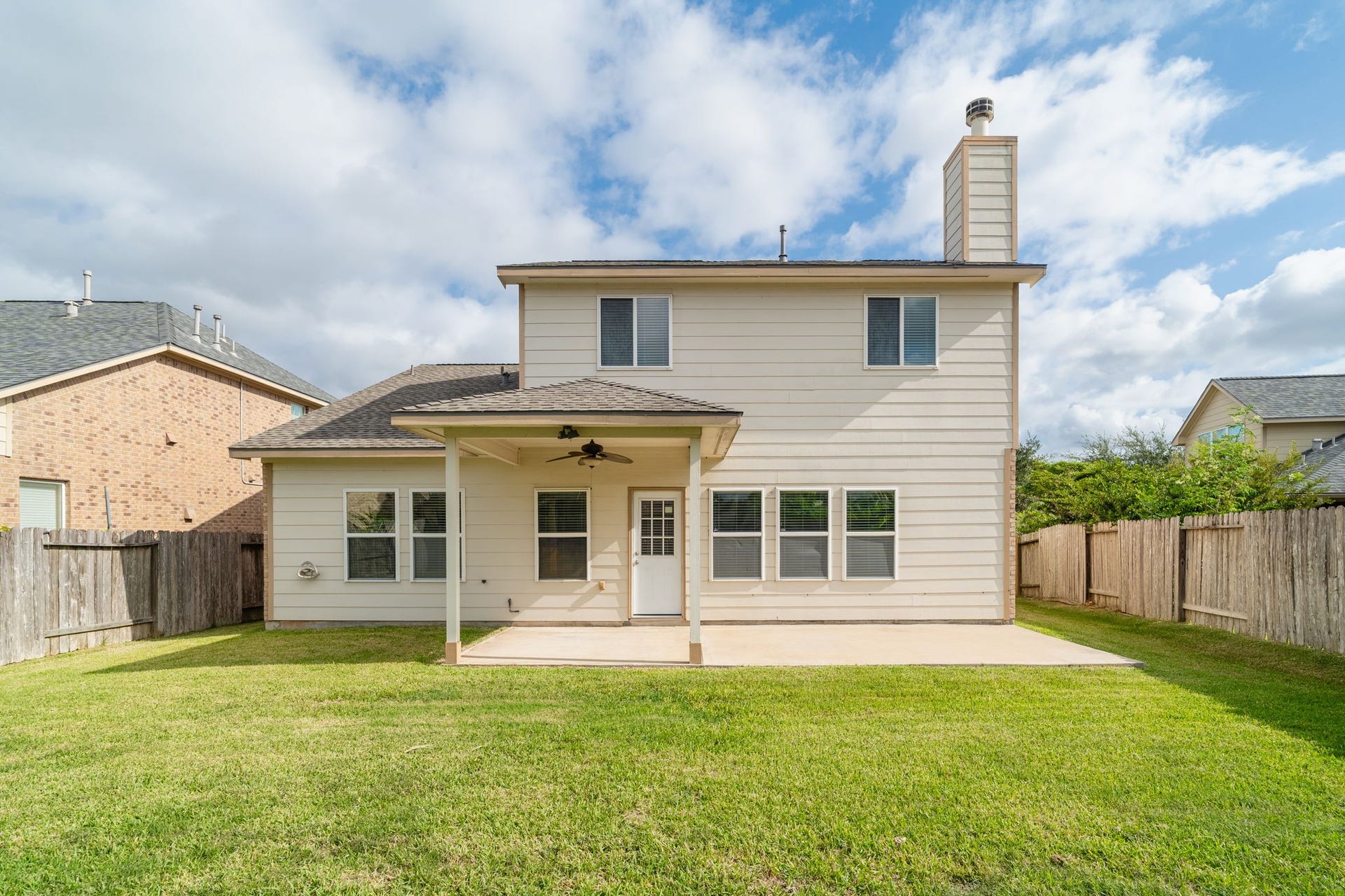 7222 Stevenson Drive, Missouri City, TX 77459 Spacious backyard featuring a covered patio, extended concrete entertaining area & plenty of green space for outdoor enjoyment.
