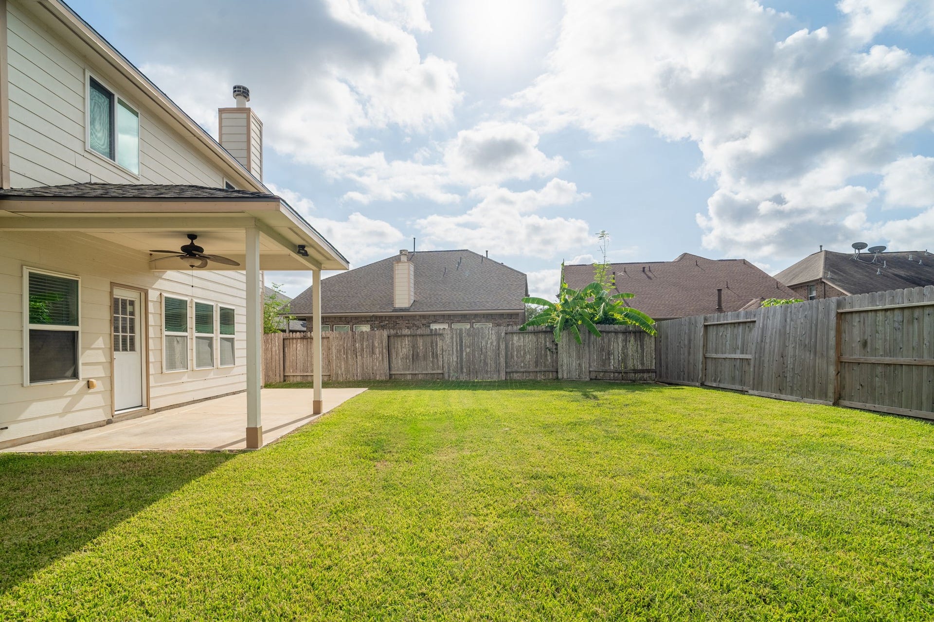 7222 Stevenson Drive, Missouri City, TX 77459 Extended concrete patio offers both covered & open-air spaces for outdoor dining, lounging & entertaining, with easy access to the spacious backyard.