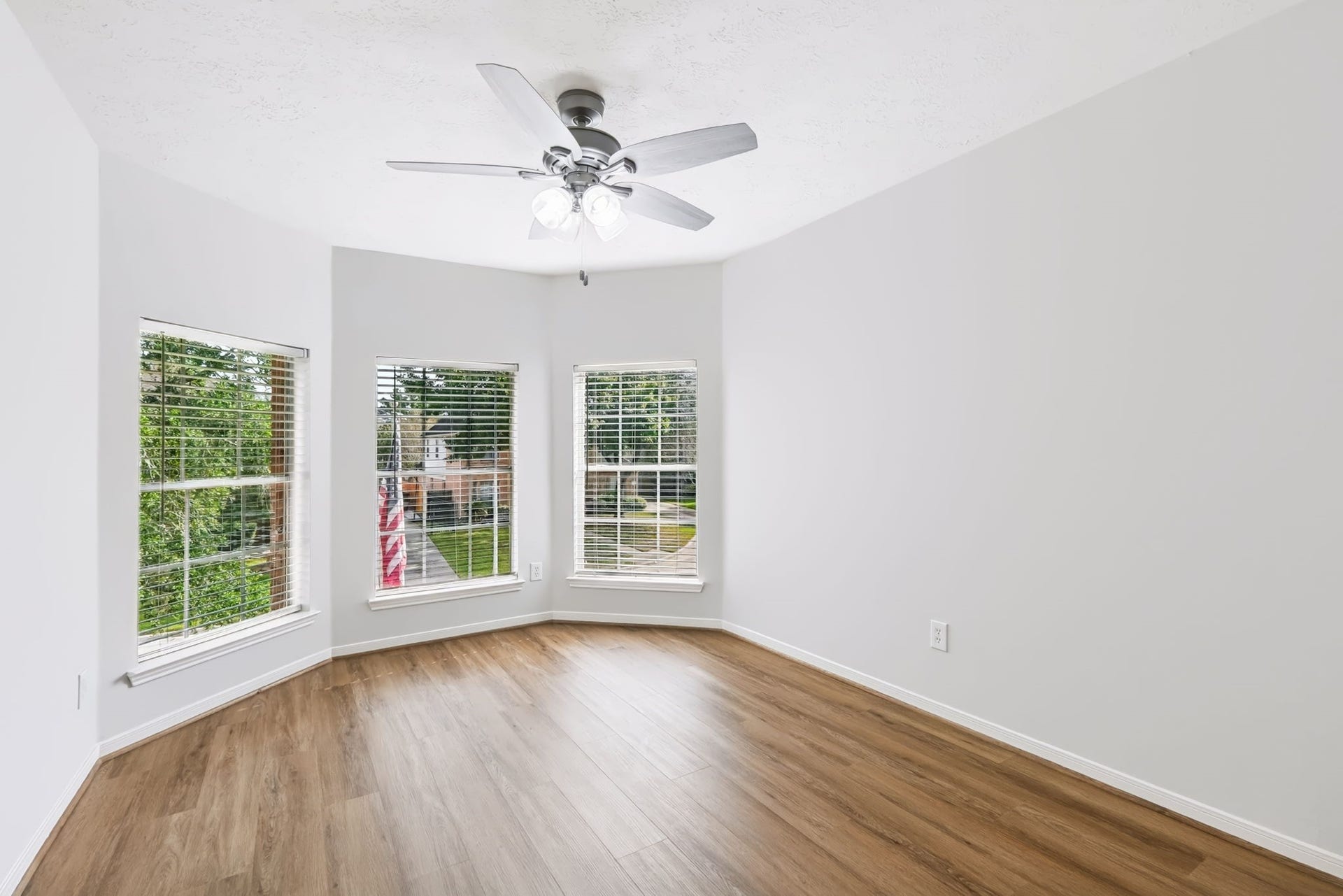 2410 Aubrey Falls Court, Katy, TX 77450 A charming window nook makes this bedroom feel extra special! Three windows bring in wonderful natural light, creating an inviting space for relaxing, reading or simply enjoying a little quiet time.