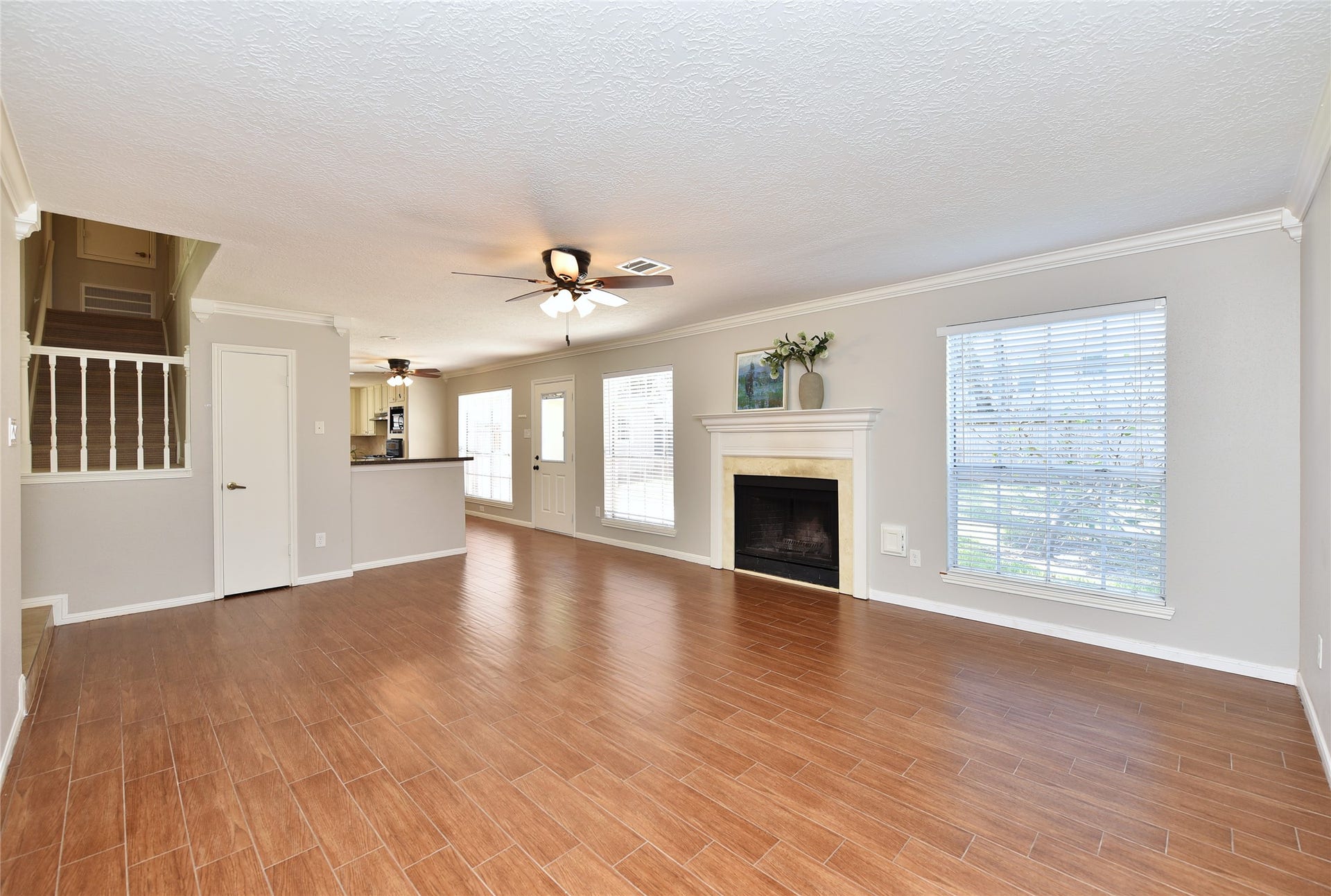 907 Sugarfield Court, Sugar Land, TX 77498 The family room is open to the kitchen area.