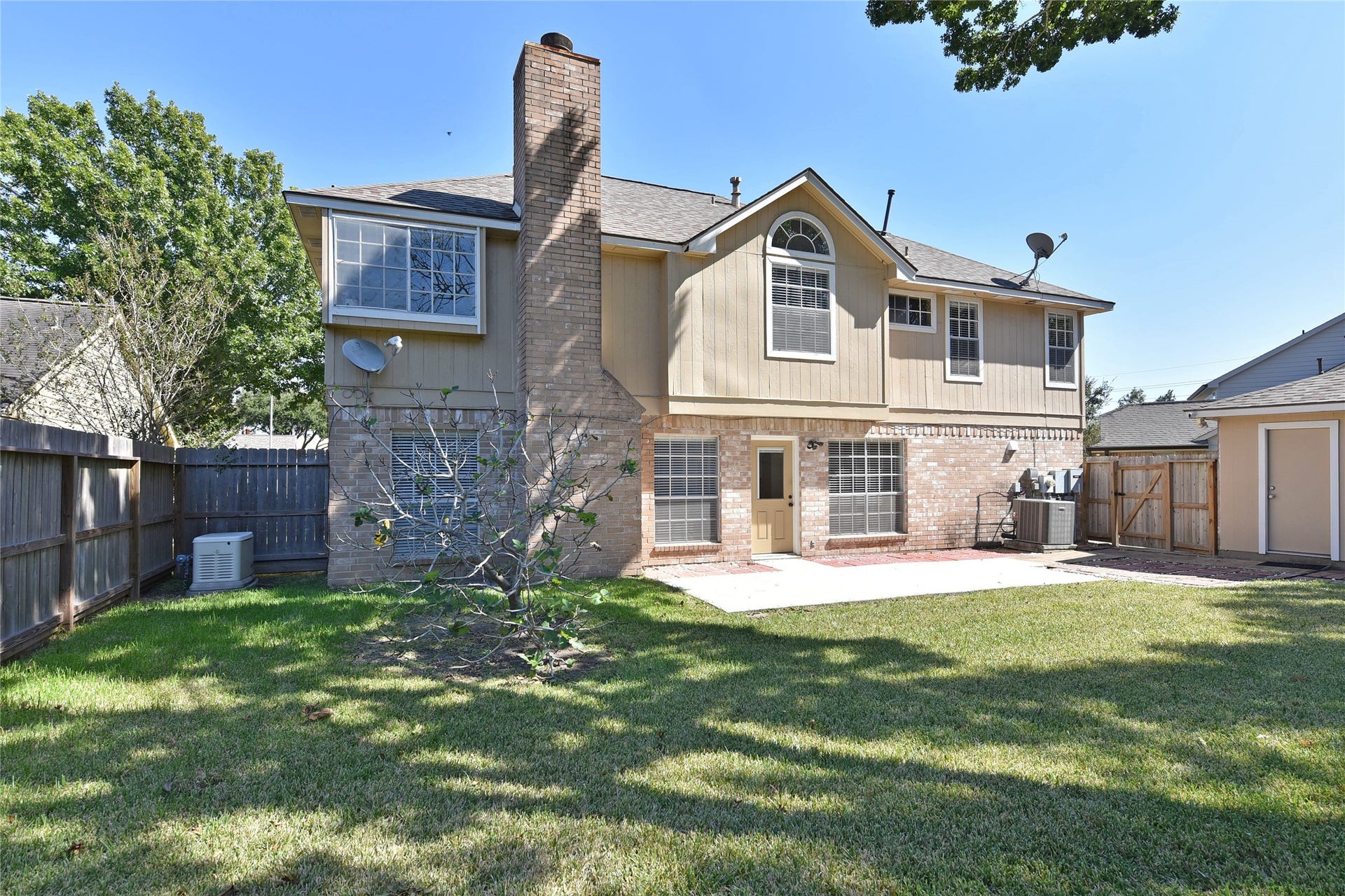 907 Sugarfield Court, Sugar Land, TX 77498 Extended patio and lots of room to play in fenced backyard.
