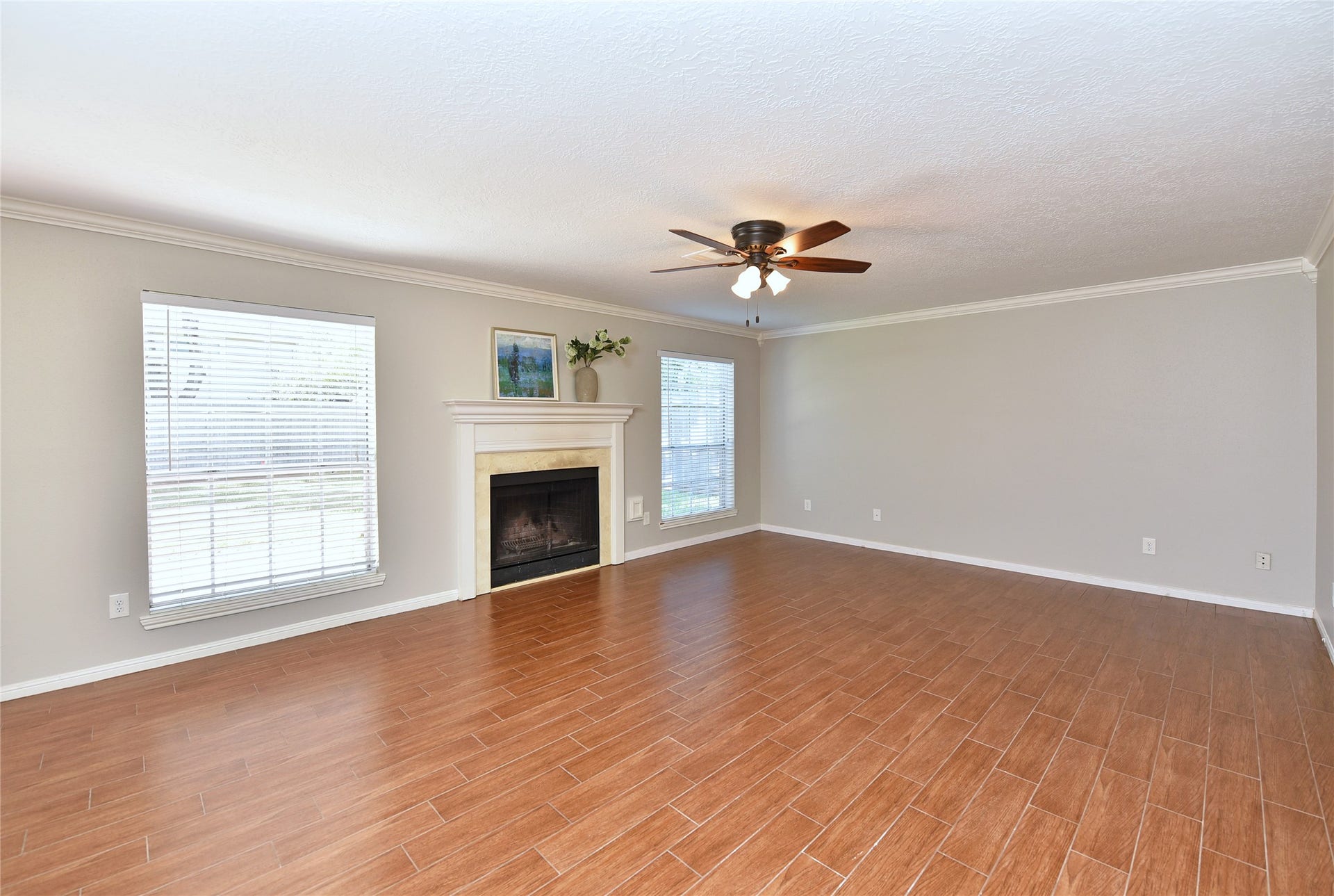 907 Sugarfield Court, Sugar Land, TX 77498 The large family room has a wood burning fireplace.
