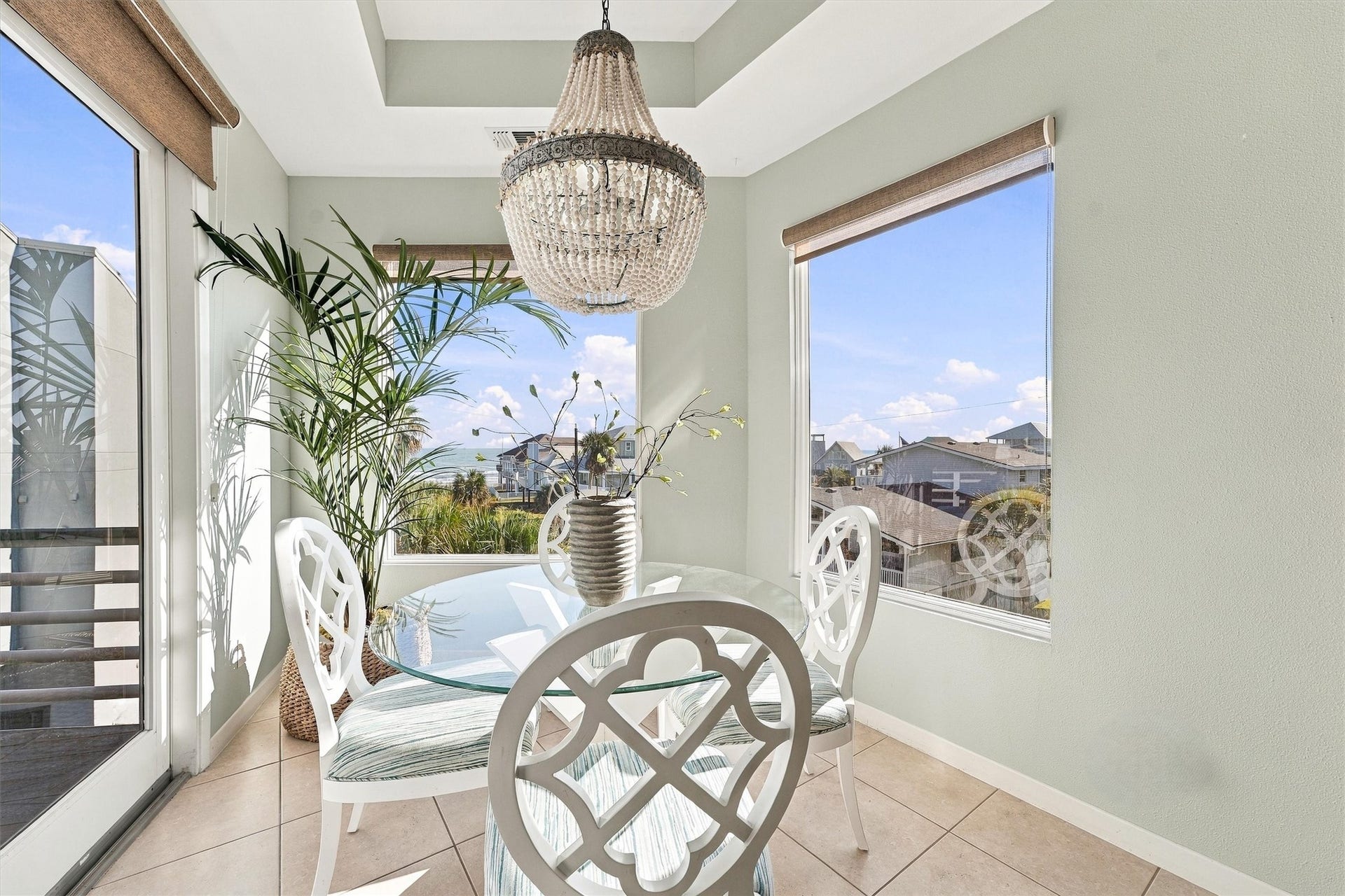 4207 Barataria Court, Galveston, TX 77554 Linger over breakfast as sunlight pours through tall windows with beach views, this charming dining nook makes everyday meals feel like a coastal getaway.
