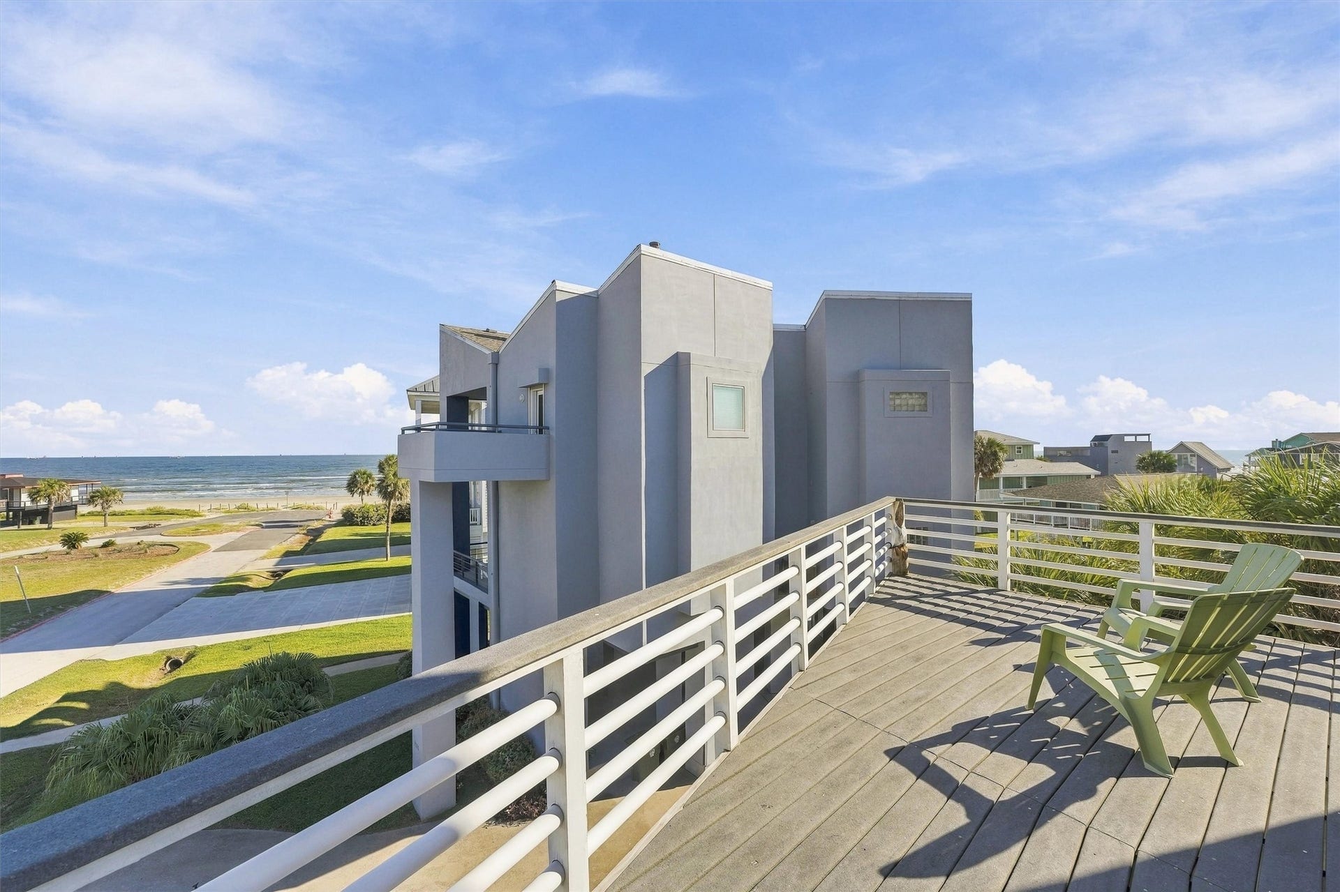 4207 Barataria Court, Galveston, TX 77554 Your next beach walk is just steps away. Looking out across the neighborhood toward the sand and water, this balcony view captures the easy connection between home and shore.