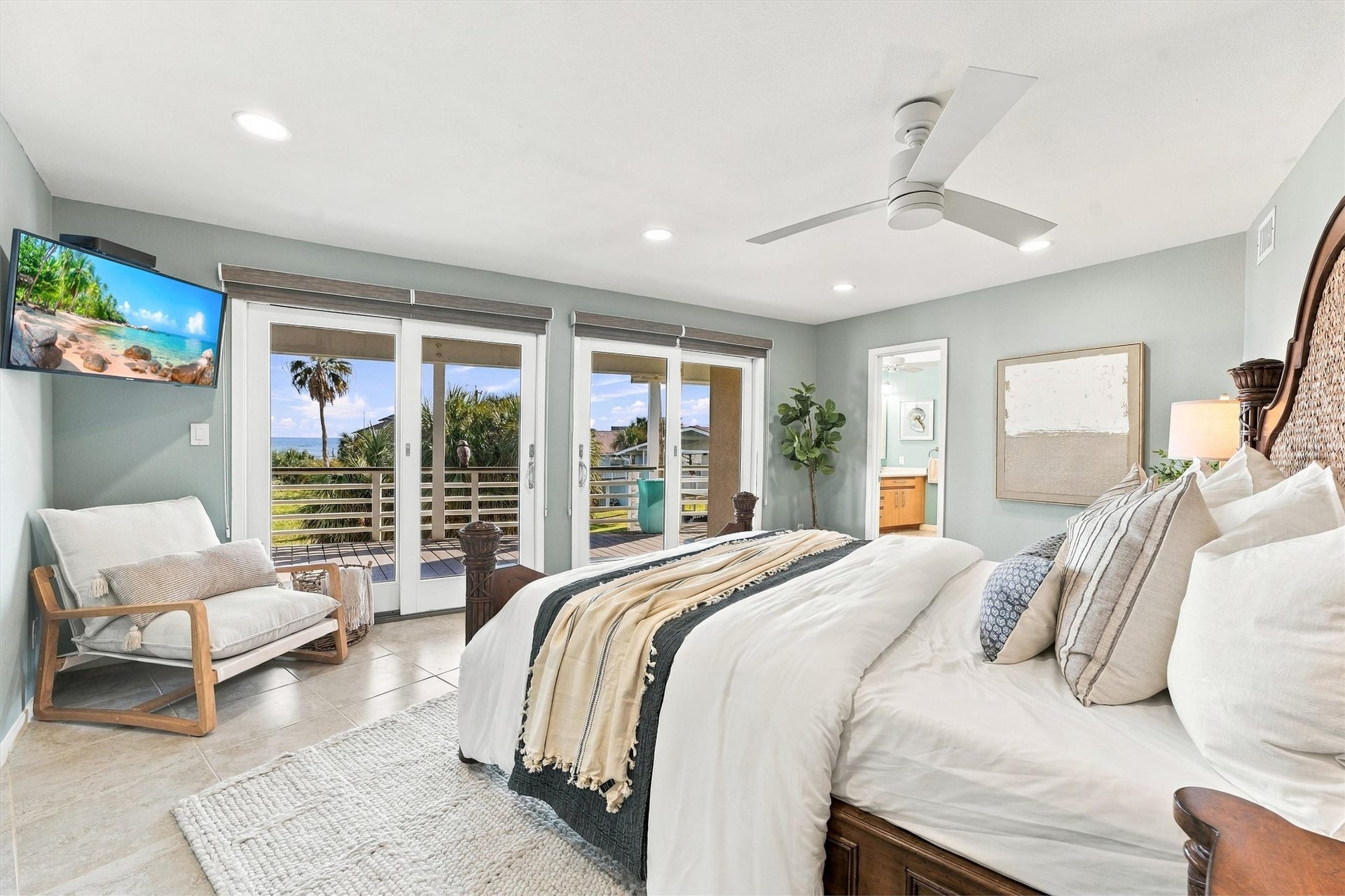 4207 Barataria Court, Galveston, TX 77554 Wake to sparkling water views, then slip outside with your morning coffee. This light-filled primary retreat opens onto a covered balcony, offering a peaceful place to begin and end your island days.