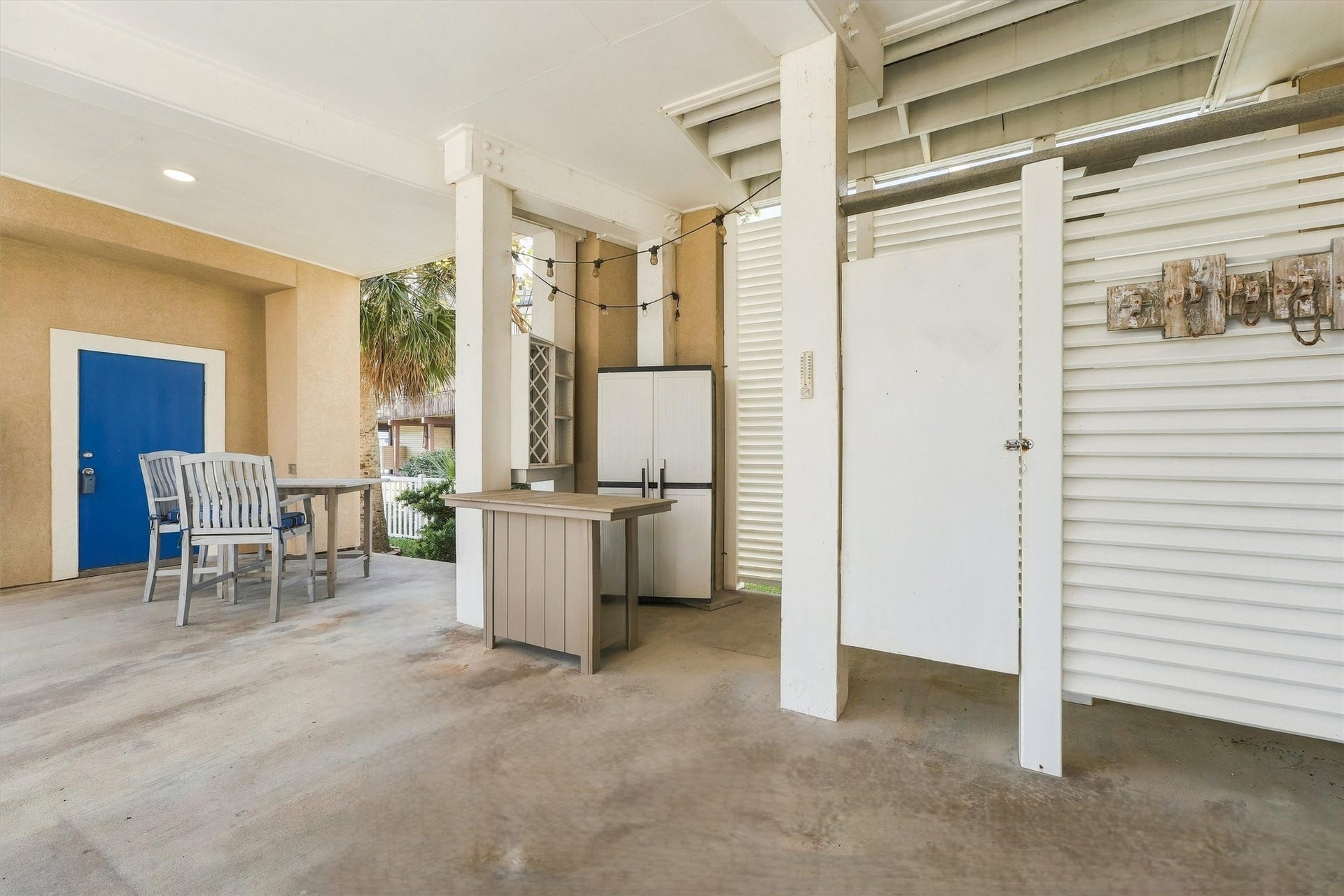 4207 Barataria Court, Galveston, TX 77554 Rinse off in the enclosed outdoor shower, hang up your beach towels, and settle in for the evening. Covered gathering space, a serving counter, and string lights make the transition from beach time to downtime feel effortless.