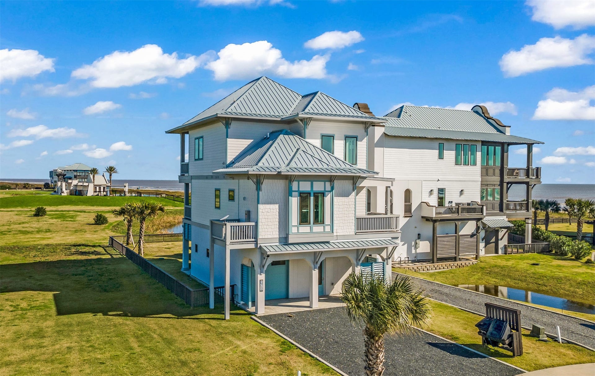 312 Seagrass, Gilchrist, TX 77617 Side view. So much green space and the views!