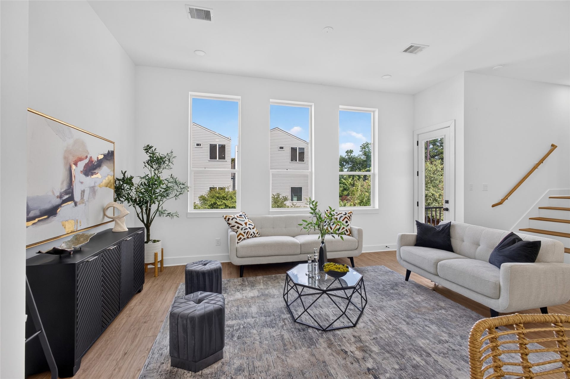 Bright living room with access to a private covered balcony, perfect for enjoying your morning coffee or evening unwind.