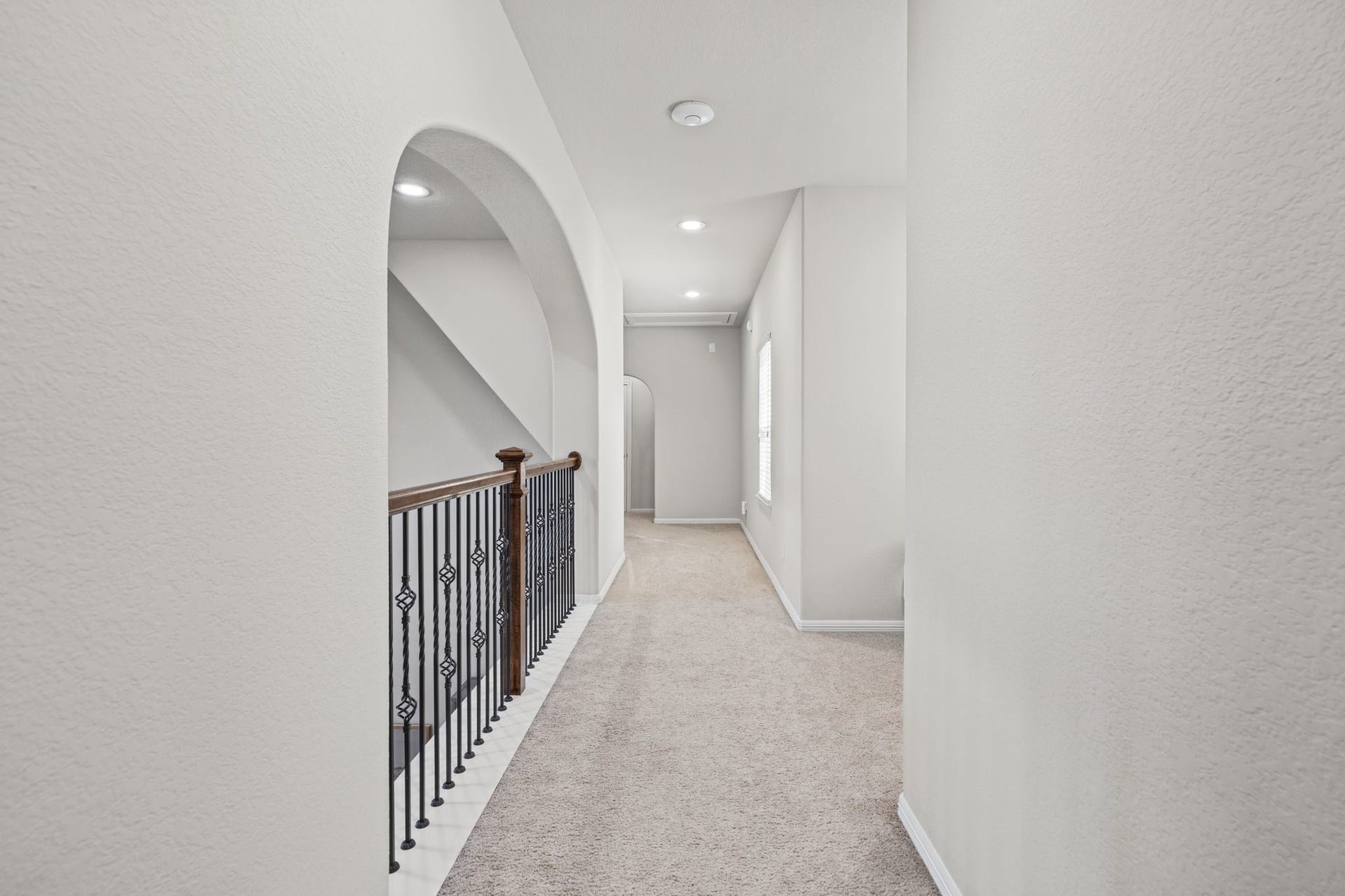 Thoughtfully designed second-floor layout features two secondary ensuite bedrooms on one side of the hallway, with a spacious gameroom/playroom, convenient half bath, and dedicated media room on the opposite side.