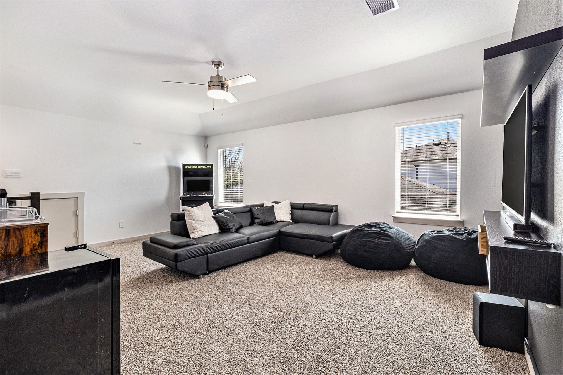Another view of the oversized upstairs game room, providing flexible space for a media room, playroom, or additional living area.