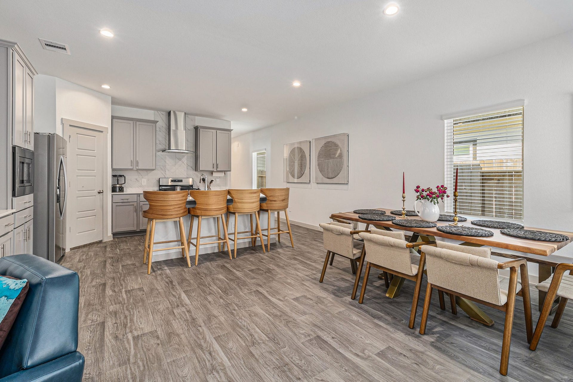Spacious dining area connects directly to the kitchen, featuring luxury vinyl plank flooring and abundant natural light.