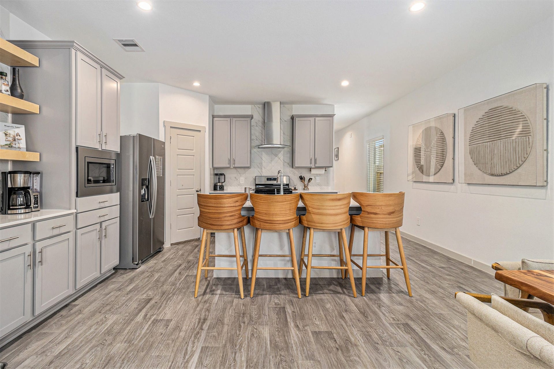 The oversized kitchen island provides seating for four and plenty of additional prep spaceperfect for casual meals and entertaining.