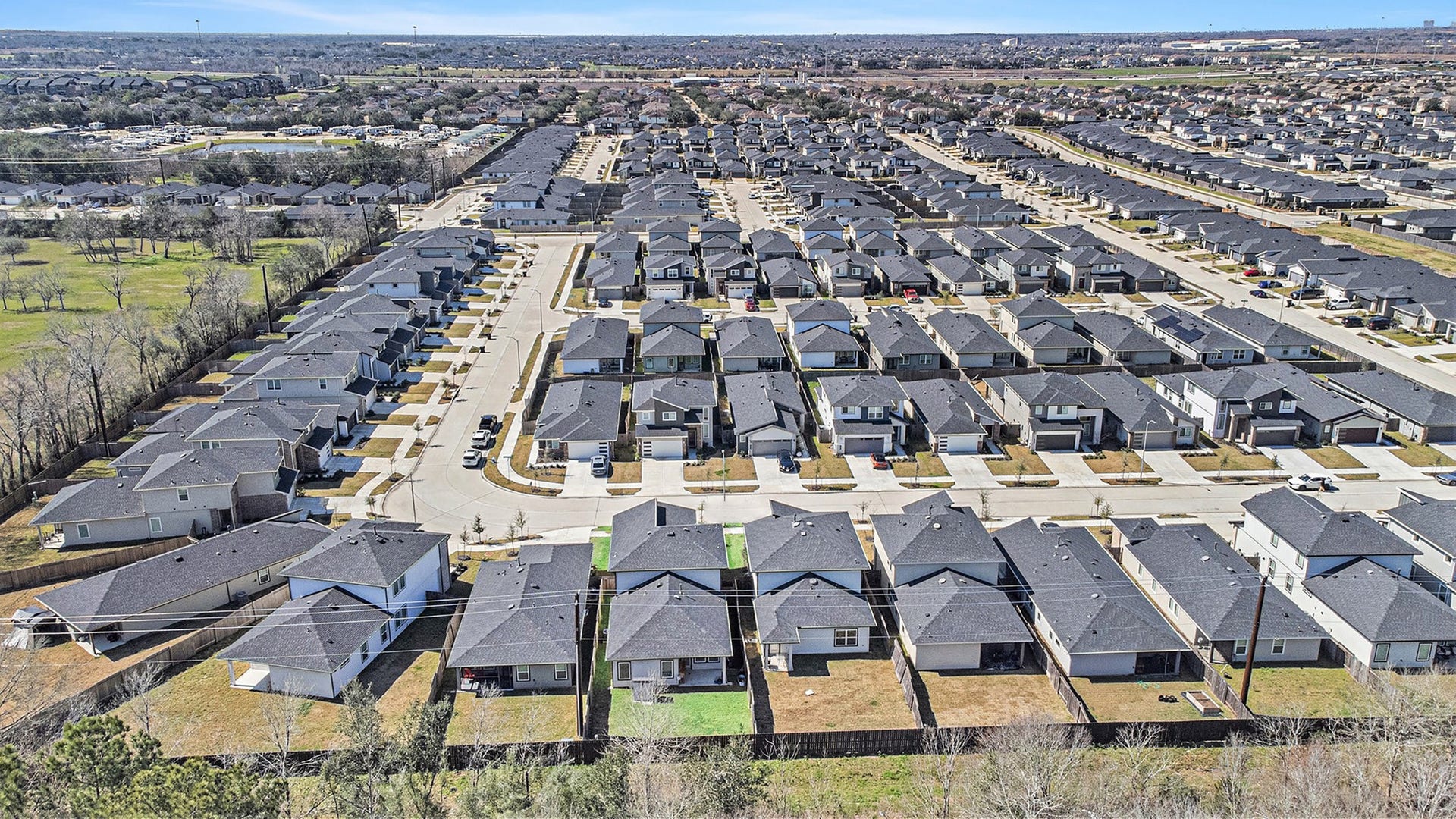 Aerial perspective of the neighborhood and surrounding area, providing a great look at the homes location within the community. Photo taken prior to the addition of the deck and pergola.