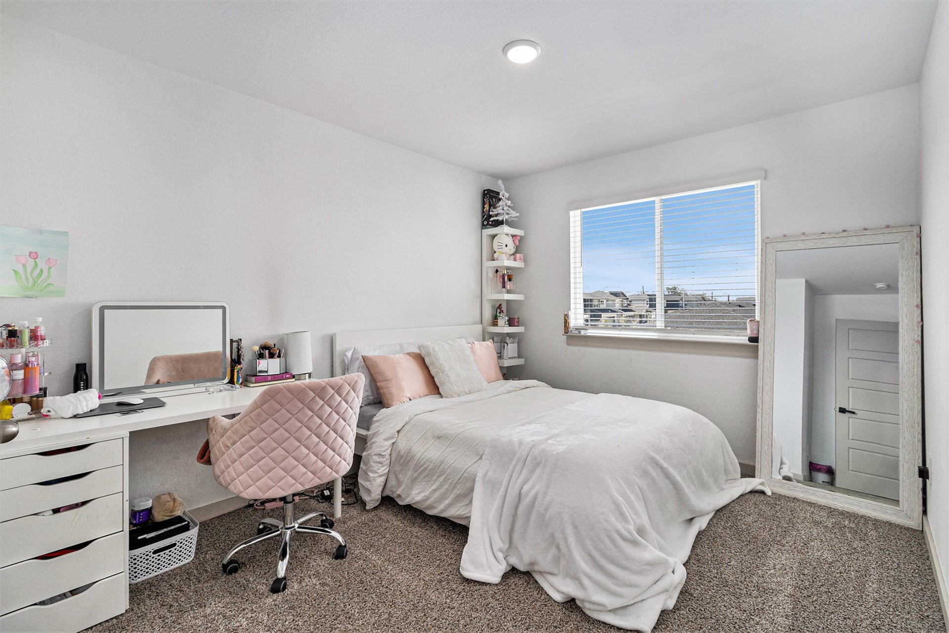 Another generously sized upstairs bedroom with abundant natural light and flexible space for sleeping, studying, or a home office.