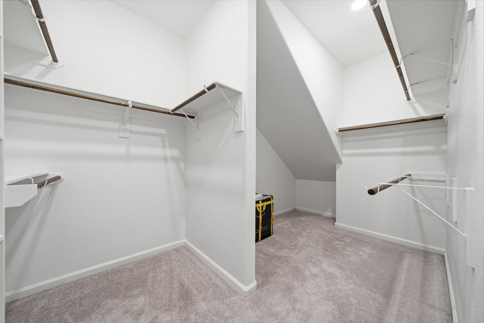 2446 Rosemary Sage Drive, Brookshire, TX 77423 Spacious primary bedroom walk-in closet offering ample storage and room to keep everything organized.