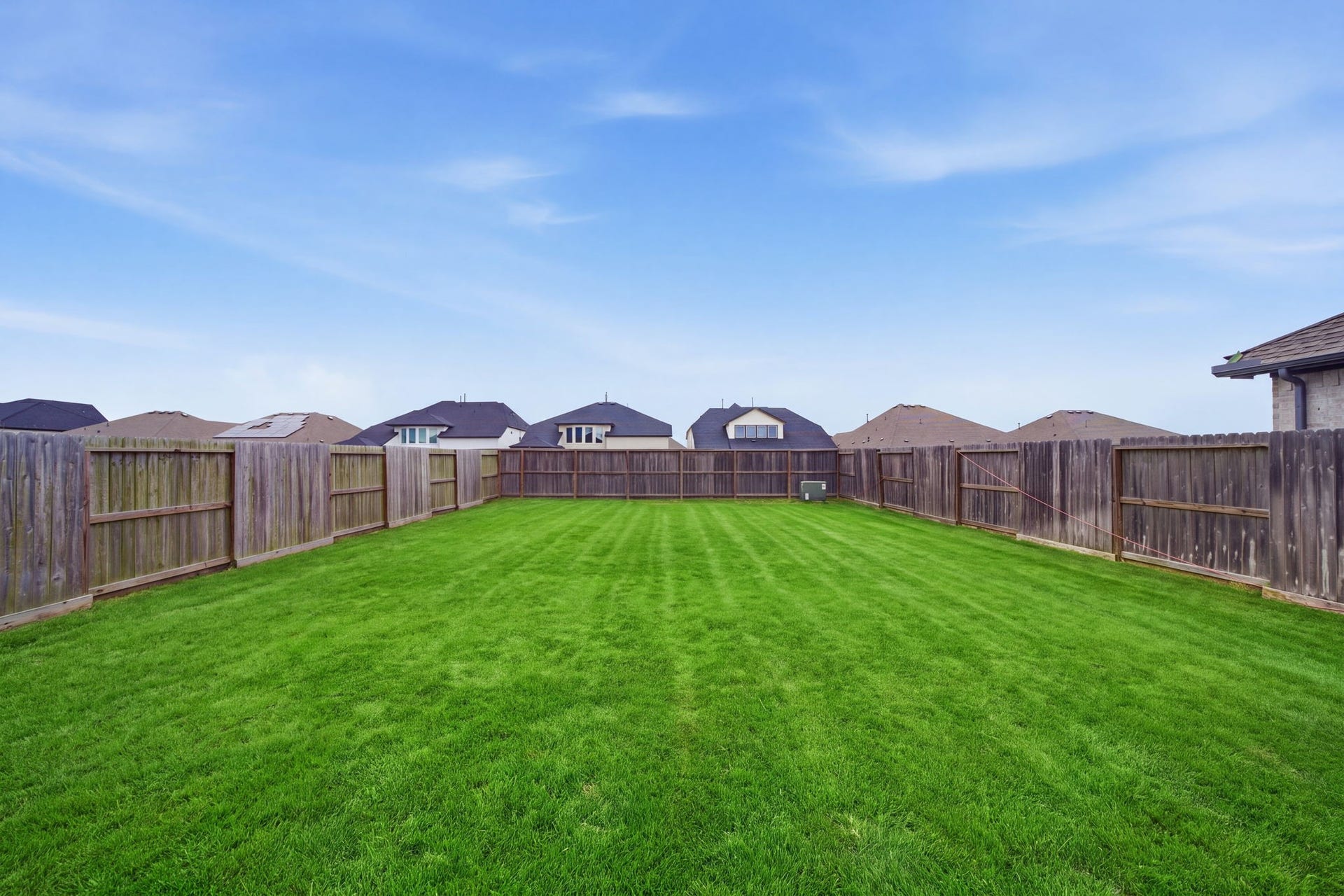 2446 Rosemary Sage Drive, Brookshire, TX 77423 Spacious backyard offering a versatile outdoor space for relaxing, dining, and entertaining.