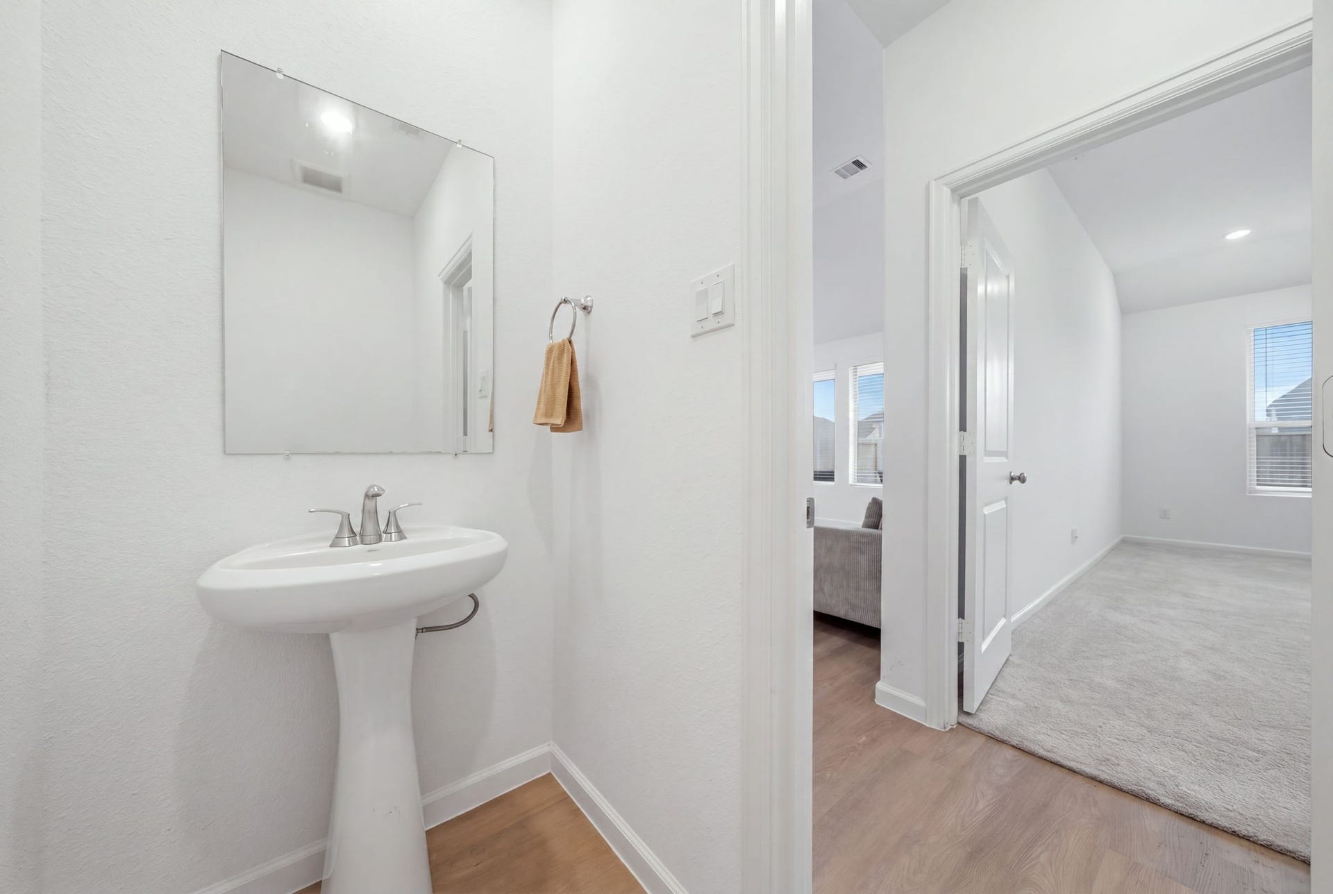 2446 Rosemary Sage Drive, Brookshire, TX 77423 Powder room adding a touch of elegance and sophistication to the home.