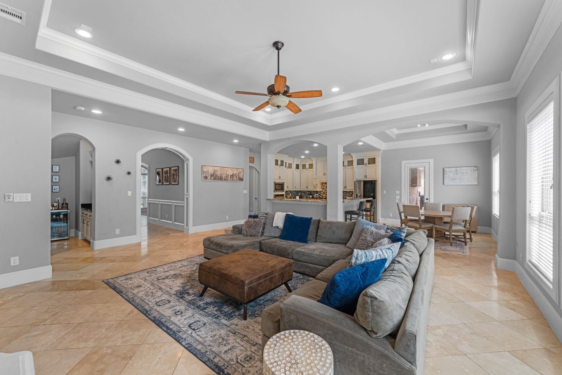 Spacious living room filled with natural light and overlooking the backyard retreat