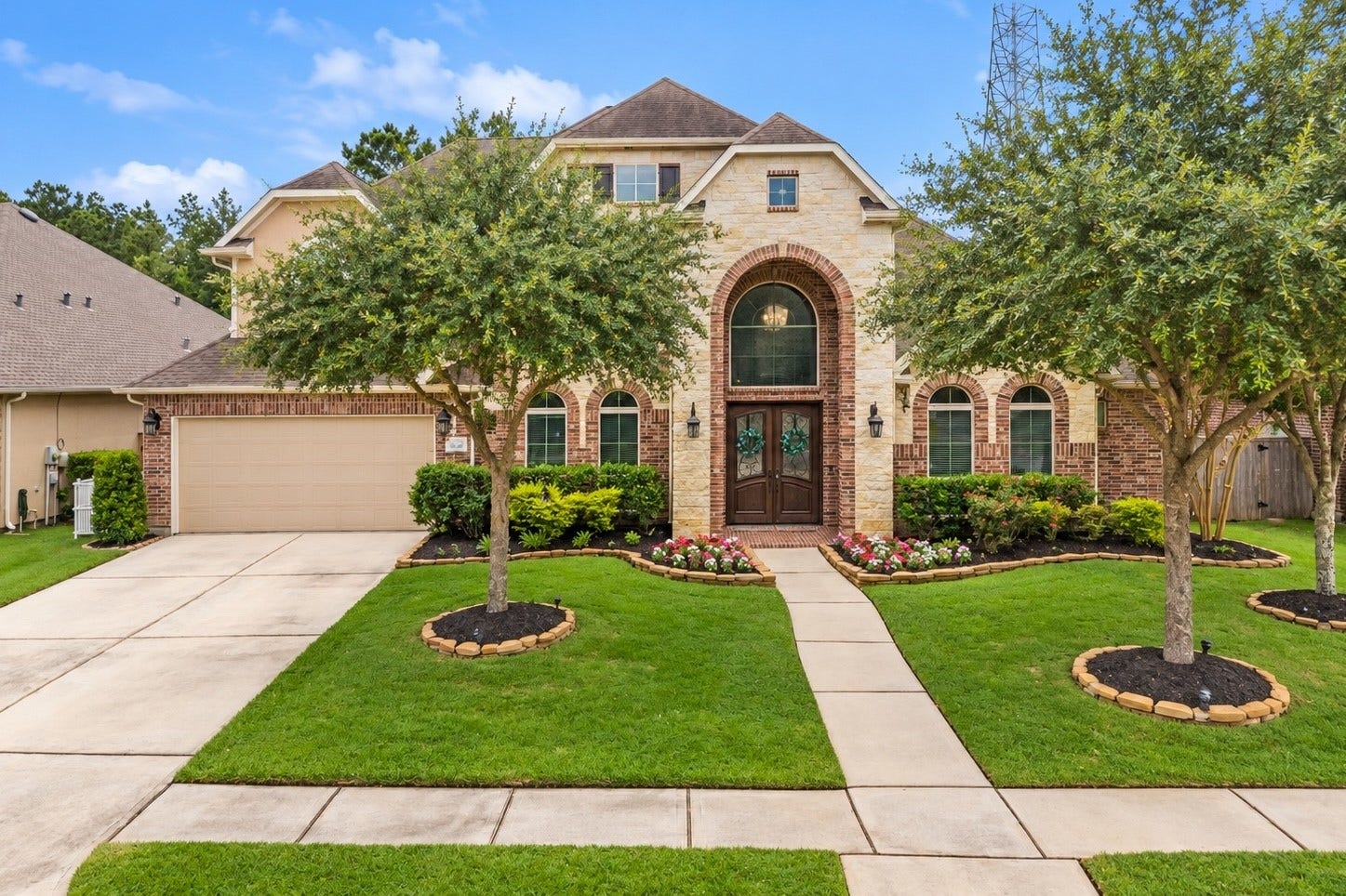Beautiful curb appeal located within the gated community of Parc Lake Estates