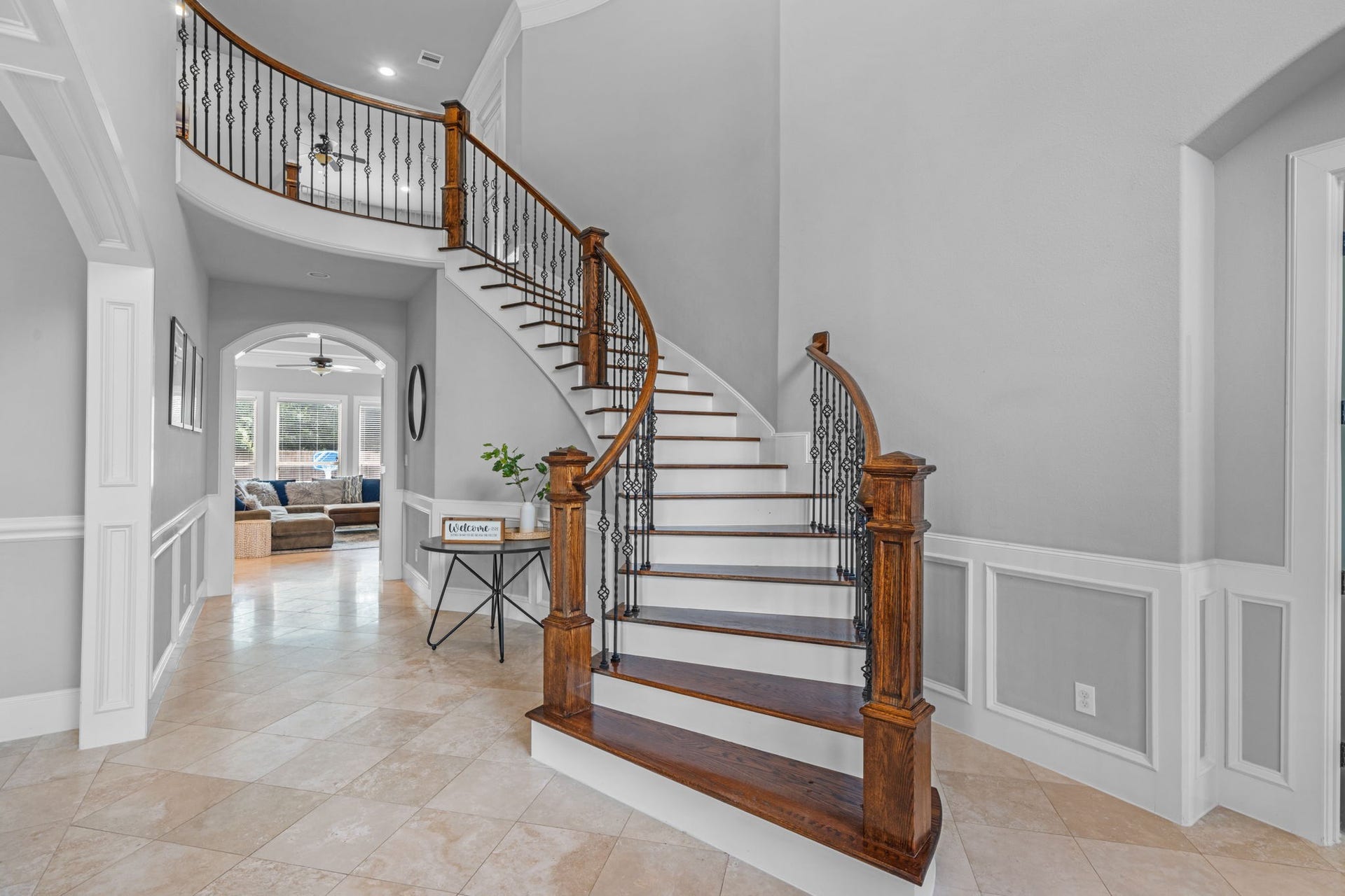 Grand foyer with soaring ceilings creating an impressive first impression