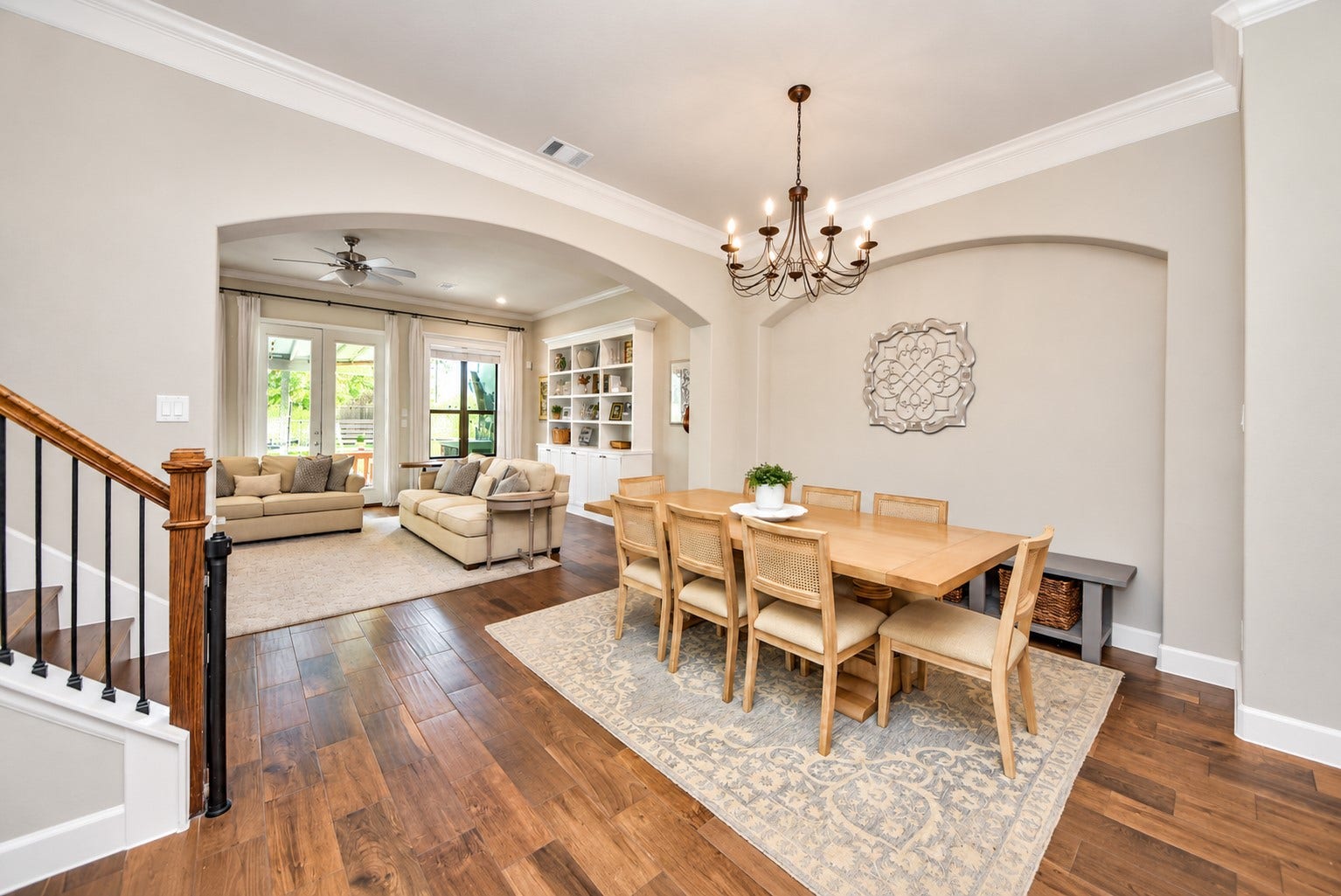 832 W 22nd Street, Houston, TX 77008 Open dining and kitchen area featuring beautiful wood flooring, a statement chandelier, and plenty of space for entertaining.