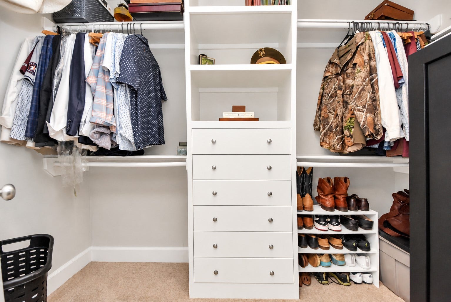 832 W 22nd Street, Houston, TX 77008 Spacious primary walk-in closet featuring custom built-in drawers, open shelving, and hanging storage.