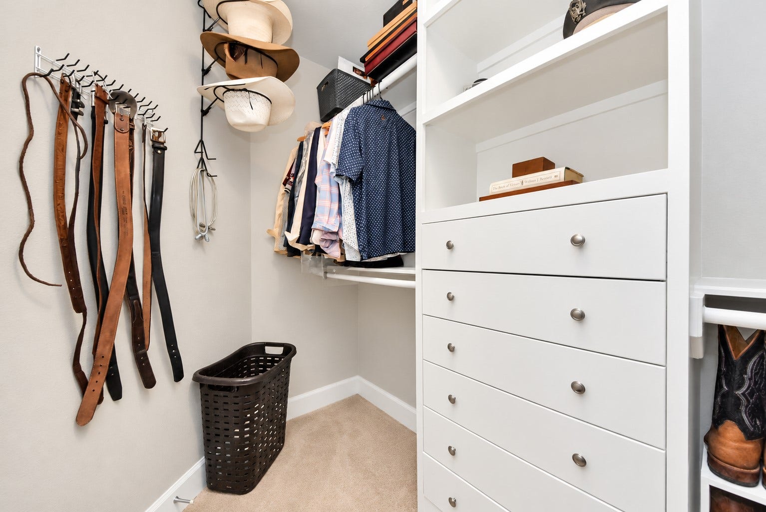832 W 22nd Street, Houston, TX 77008 Primary walk-in closet with built-in drawers, shelving, and organized storage for clothing and accessories.