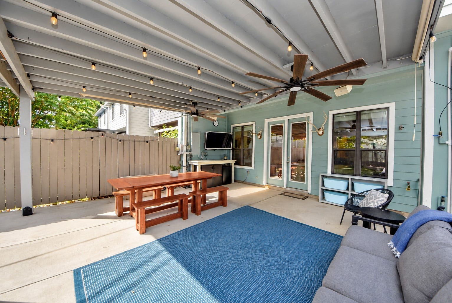 832 W 22nd Street, Houston, TX 77008 Fantastic covered patio featuring ceiling fans, string lighting, and generous space for outdoor dining, entertaining, or relaxing year-round.