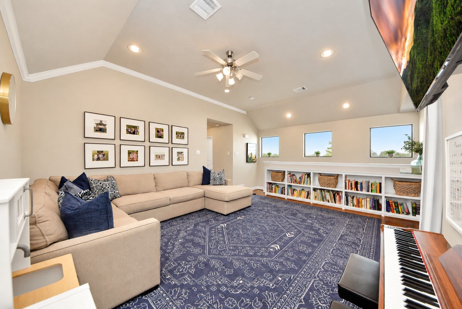 832 W 22nd Street, Houston, TX 77008 Another view of the expansive game room showcasing the vaulted ceiling, recessed lighting, custom built-ins, and versatile layout perfect for a media room or entertainment space.