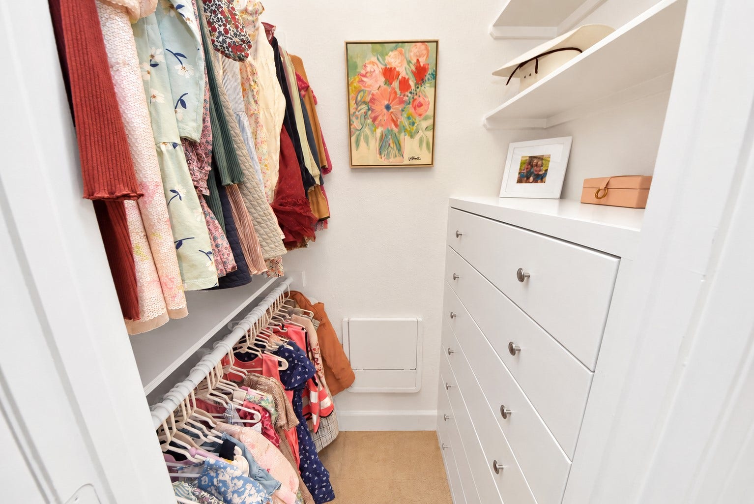 832 W 22nd Street, Houston, TX 77008 Well-organized walk-in closet featuring built-in drawers, generous shelving, and double hanging rods to maximize storage and functionality.