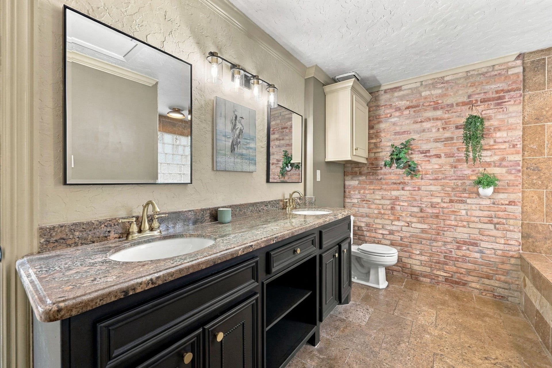 30 Bitterwood Circle, The Woodlands, TX 77381 Primary Bath at back of house with double sinks and brick wall accent