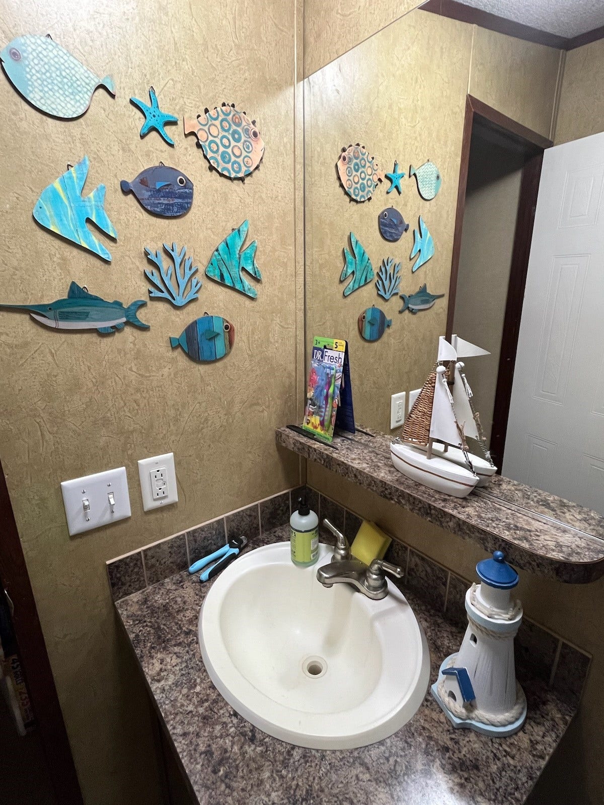 4715 3rd Street, Bacliff, TX 77518 Secondary bath vanity and sink area have a built-in shelf for additional storage.