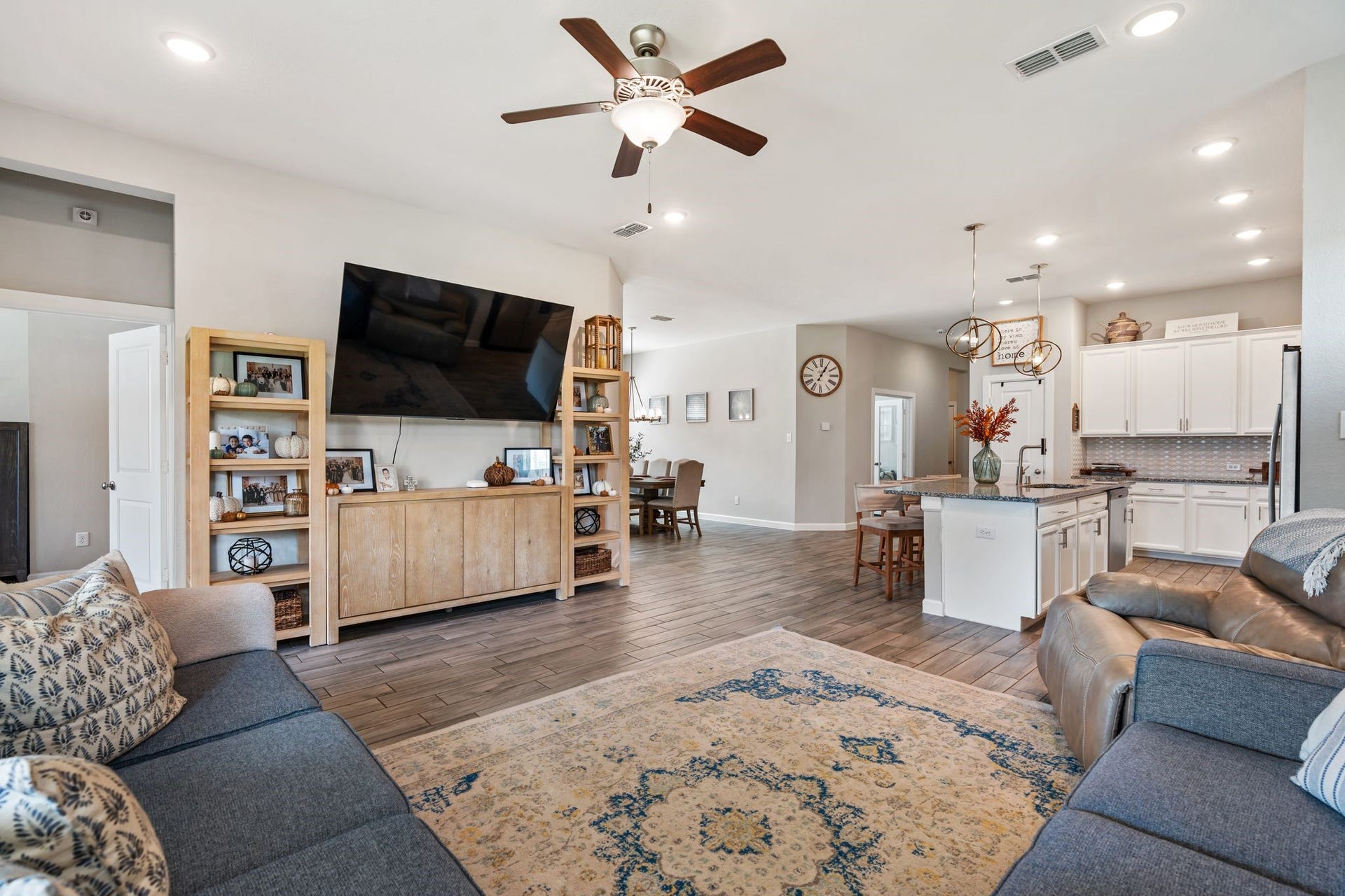 Beautiful, spacious living room with ceiling fan.
