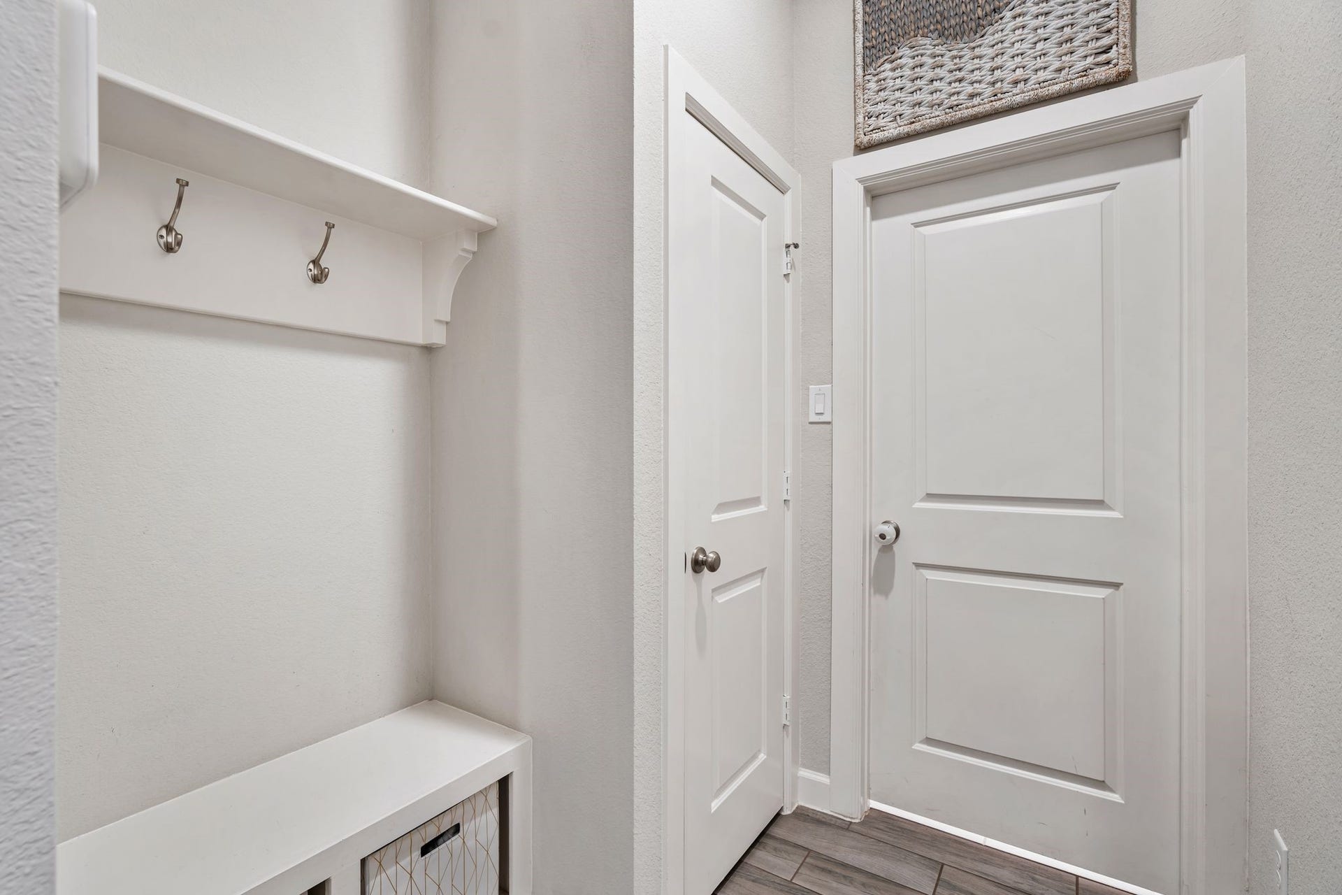 A true mudroom for holding all of your belongings as you enter through the garage, laundry room to your right.