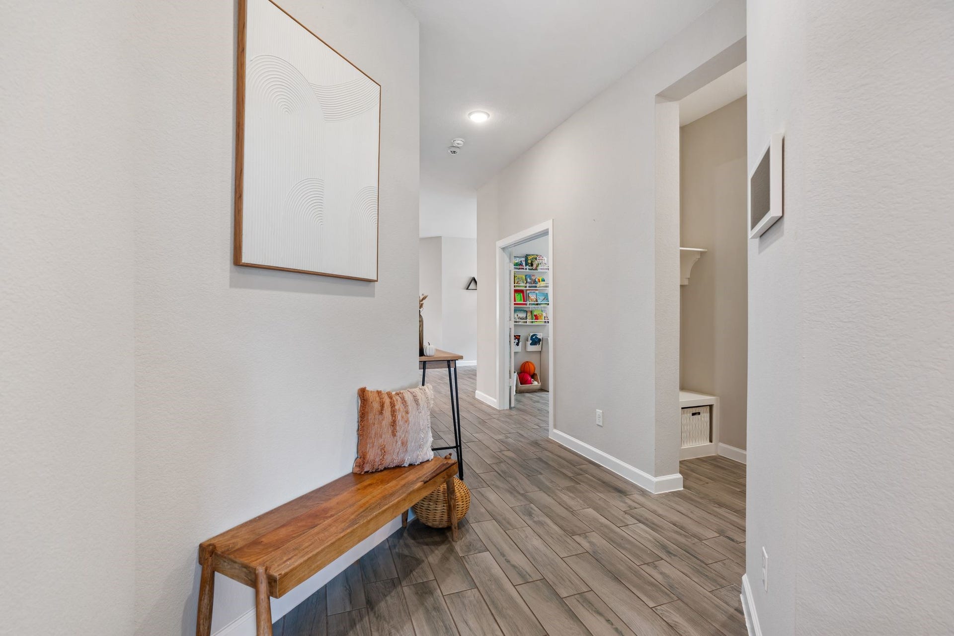 Entryway features 2 bedrooms to your left, mudroom and laundry room to your right, home office/study on your next right.