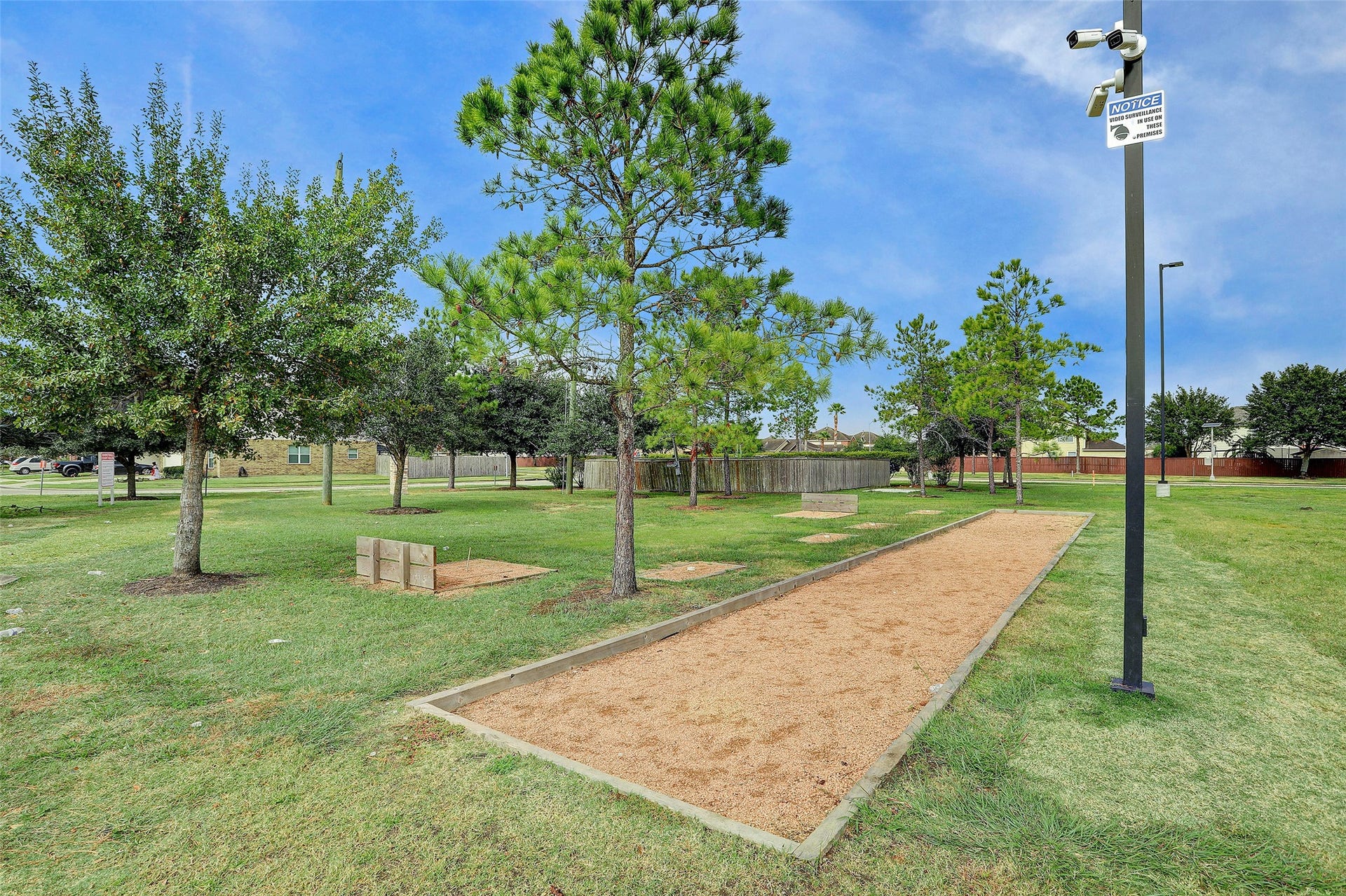 223 Sunset Colony Drive, Rosharon, TX 77583 More outdoor fun is waiting with a dedicated game area surrounded by open green space and mature trees.