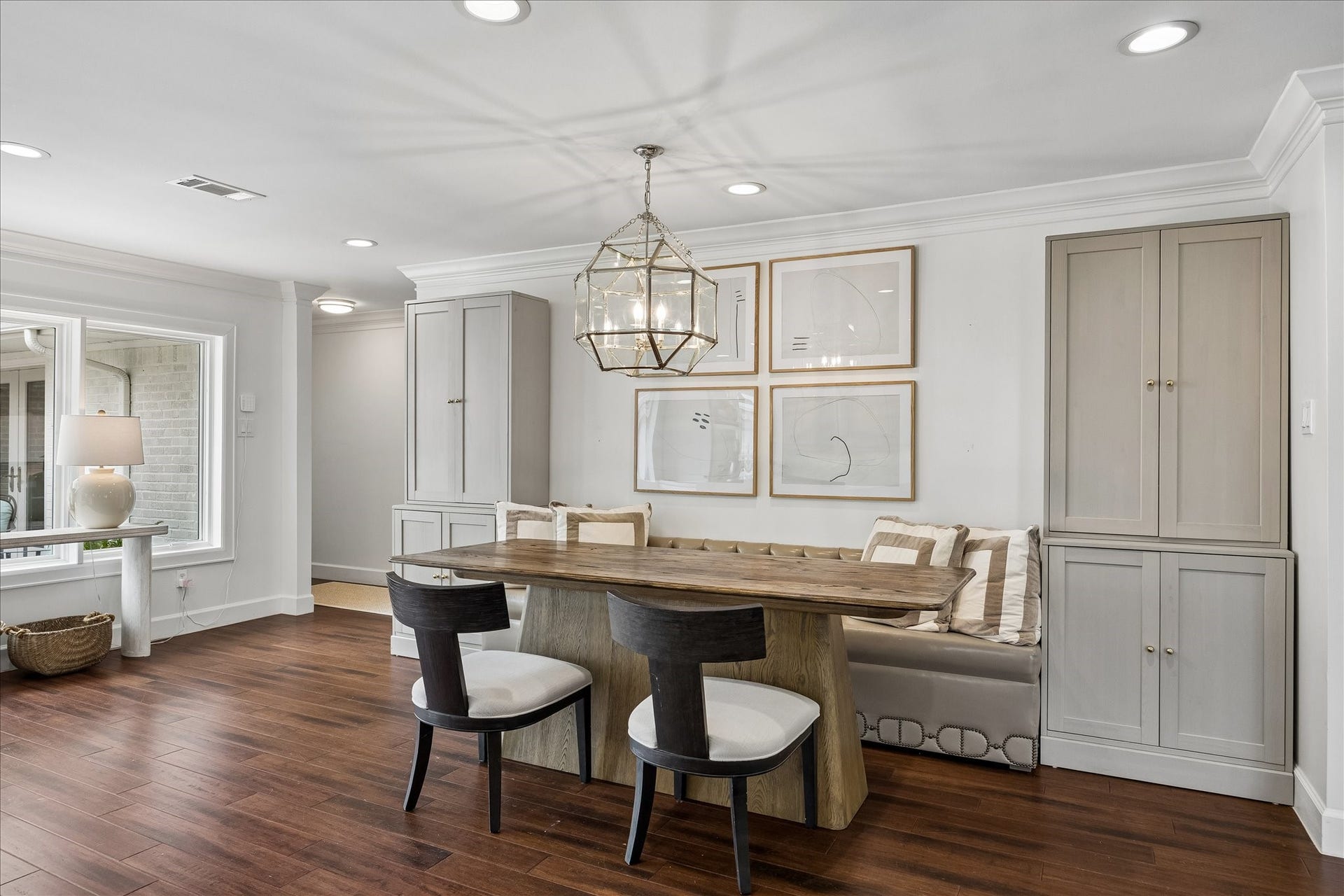 3702 Linkwood Drive, Houston, TX 77025 Stylish banquette flanked by cabinets and accented by Visual Comfort pendant light.